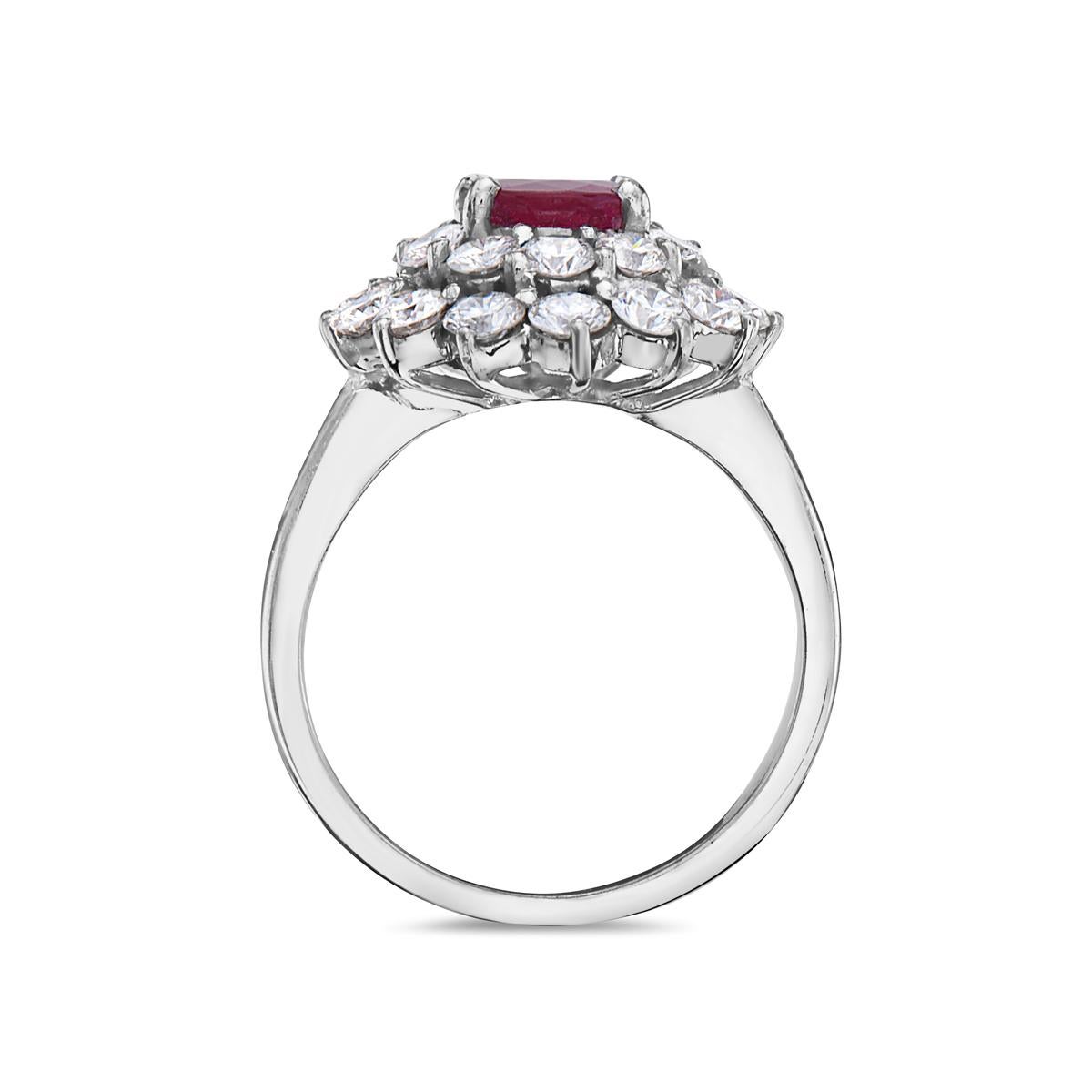 This cocktail ring features a 1.12 carat round cut ruby and and 28 round diamonds G-H color VS  clarity weighing 1.86 carats set in 18K white gold.

Resizeable upon request.

Viewings available in our NYC showroom by appointment.

