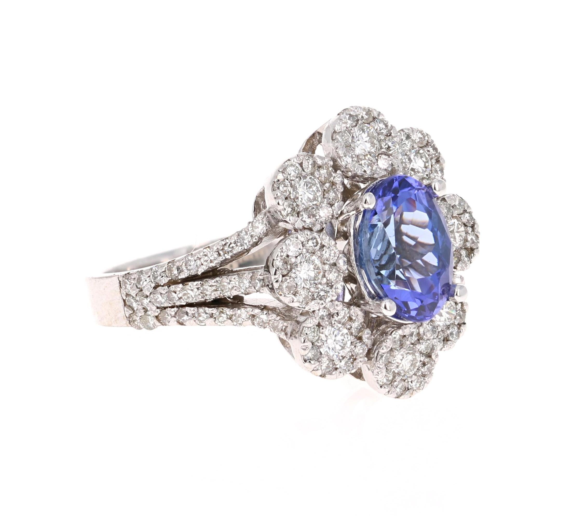 Elegant & Classic Tanzanite & Diamond Ring! 

This ring has a radiant bluish-purple Oval Cut Tanzanite weighing 1.98 Carats. It is surrounded by 126 Round Cut Diamonds that weigh 1.00 Carats. The total carat weight of the ring is 2.98 Carats. 