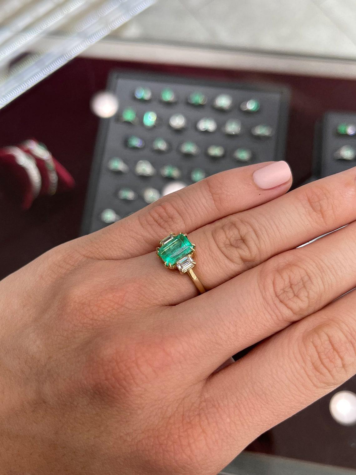emerald cut diamond ring with emeralds