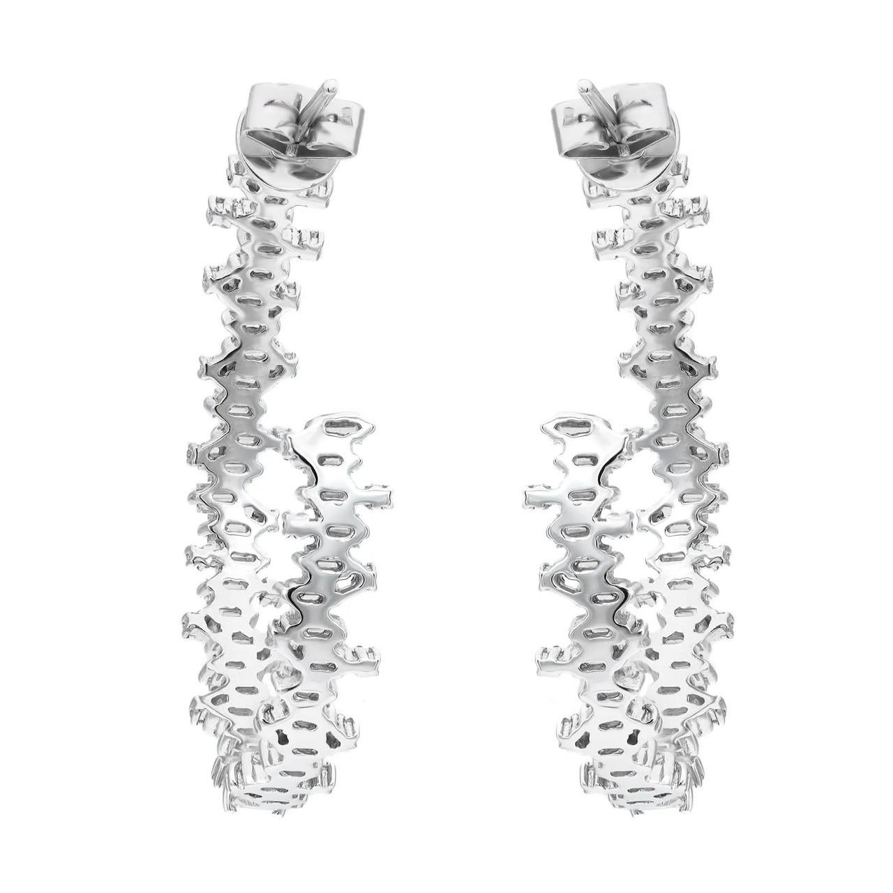 Transform your look with these mesmerizing diamond inside out hoop earrings, designed to shine in every setting. Created with precision in gleaming 18K white gold, these earrings radiate elegance and sophistication. Adorned with a dazzling array of