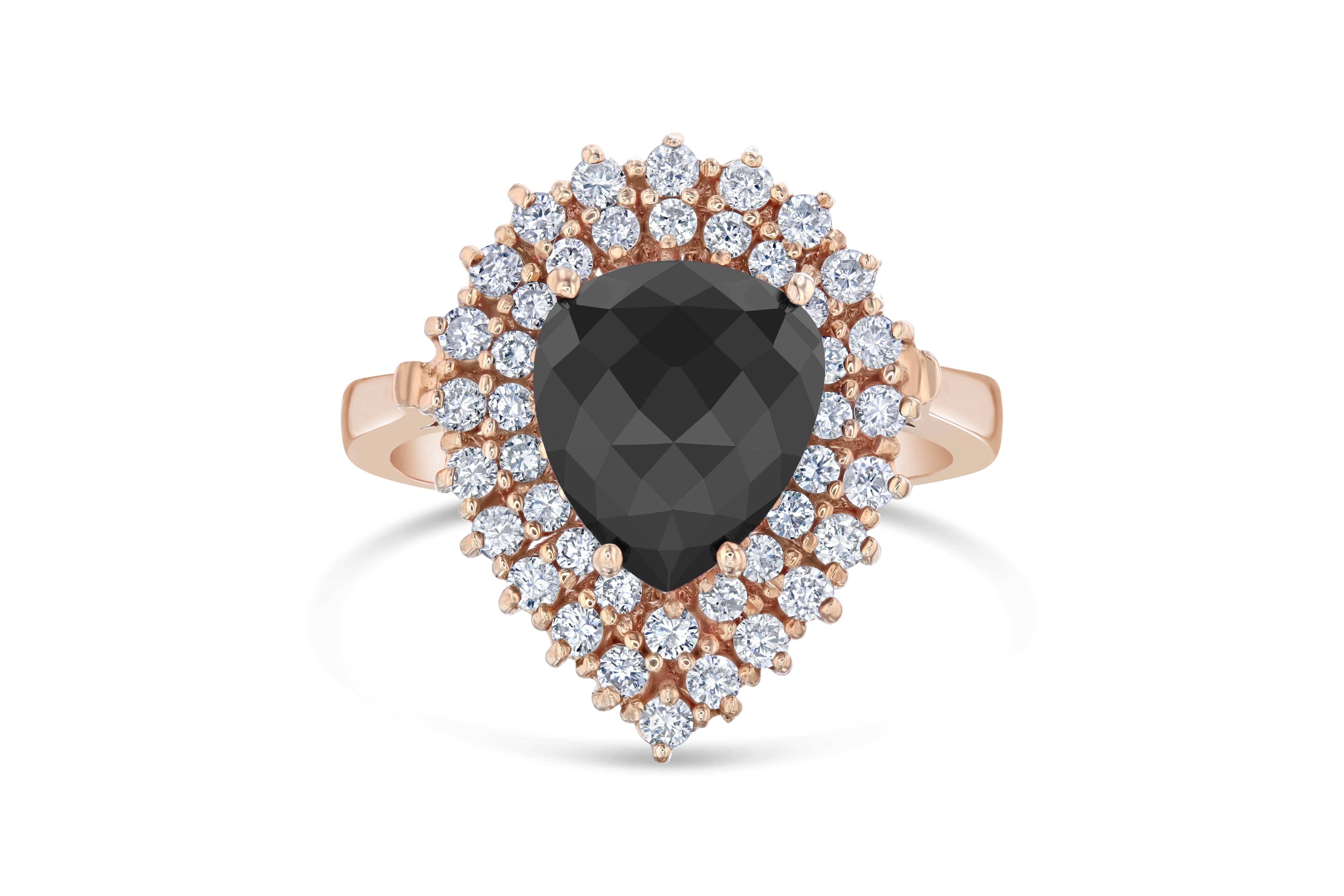 Pear Cut Black Diamond Cocktail Ring in a beautiful Rose Gold Setting

This gorgeous Rose Gold Black Diamond Ring has a center Pear Cut Black Diamond that weighs 2.29 Carats and has 43 White Round Cut Diamonds weighing 0.70 Carats. The total carat