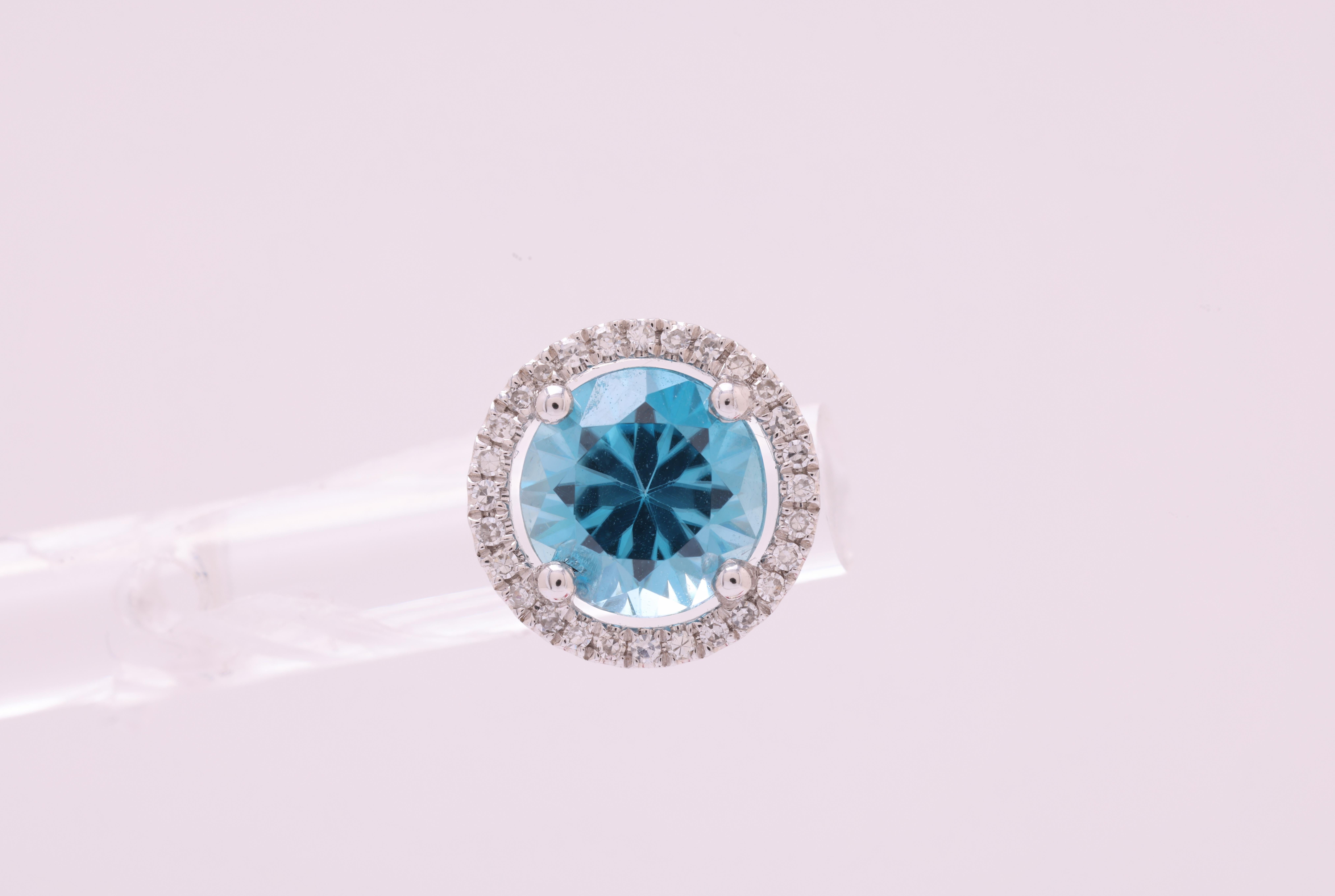 Adorn yourself with timeless elegance and unparalleled beauty with our magnificent stud earrings. These exquisite jewels are a true embodiment of luxury, featuring a pair of stunning round Blue Zircon stones, totaling an impressive 2.99 carats.