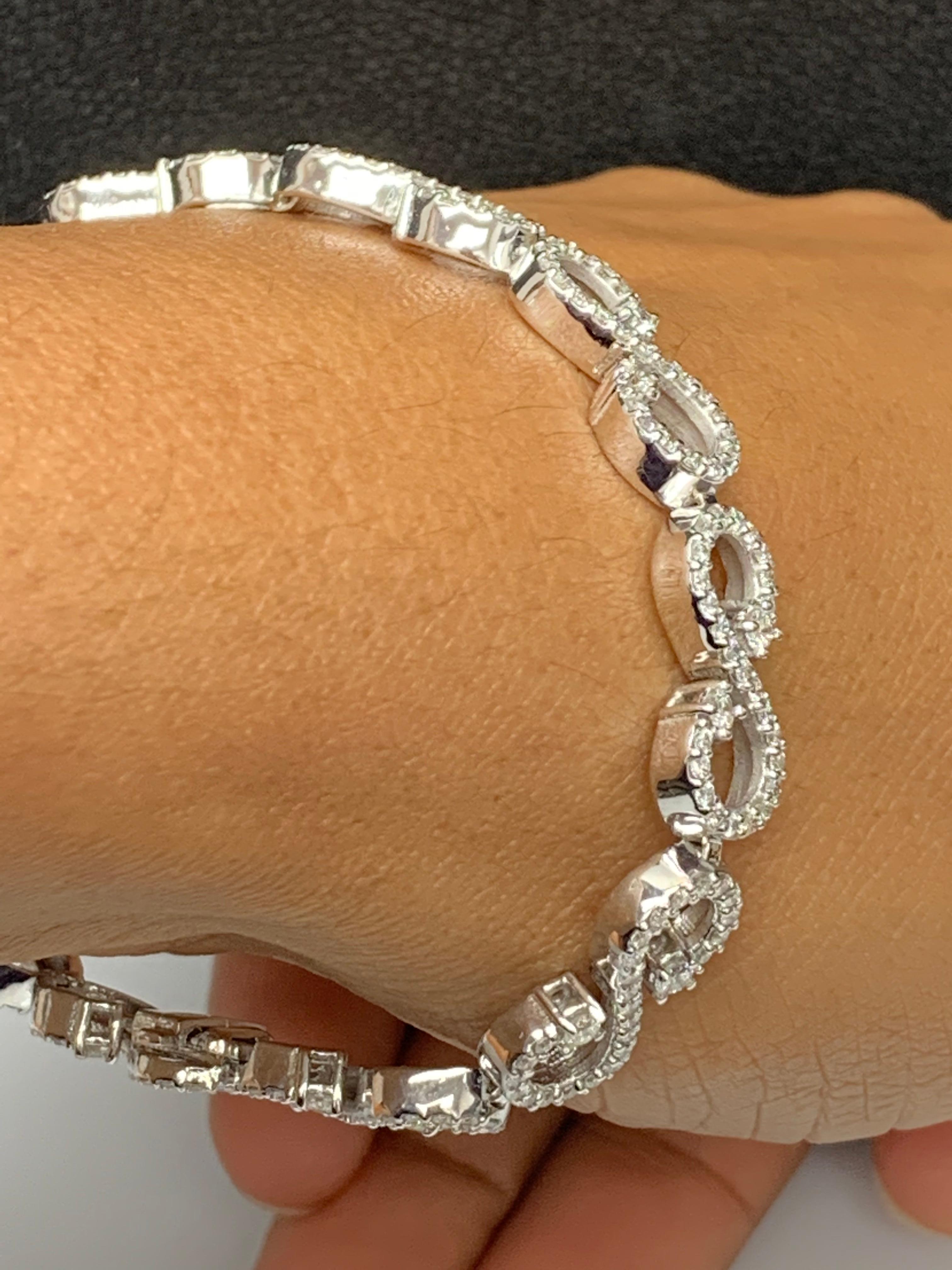 A beautiful bracelet showcasing open-work design, set with round brilliant diamonds set in a horizonntal  