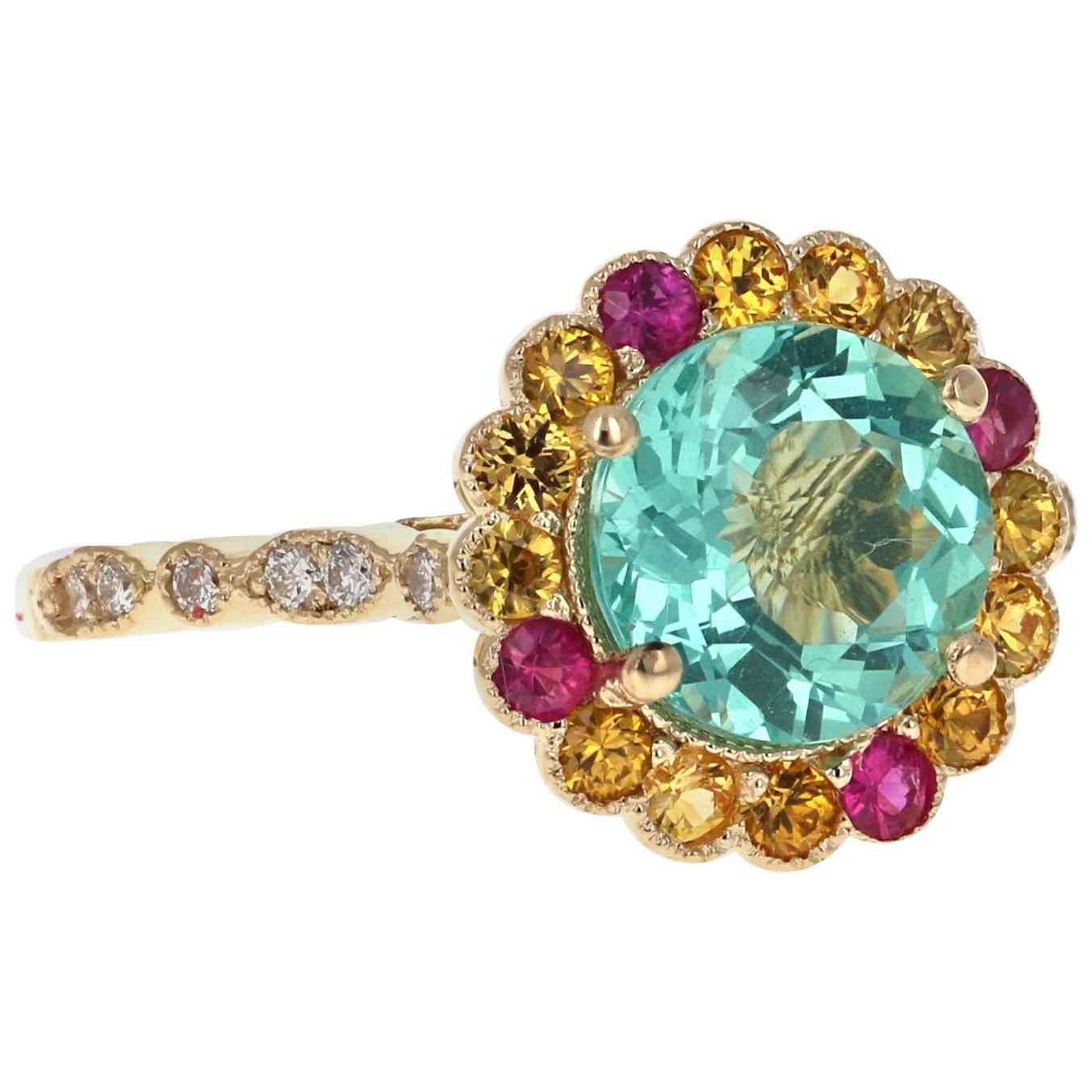 Apatite Sapphire Diamond Yellow Gold Ring

Add a little flash of color with this gorgeous Apatite, Yellow, Pink Sapphire and Diamond Ring.  This ring has a gorgeous Round Cut 2.15 carat Apatite in the center of the ring and is surrounded by a row of