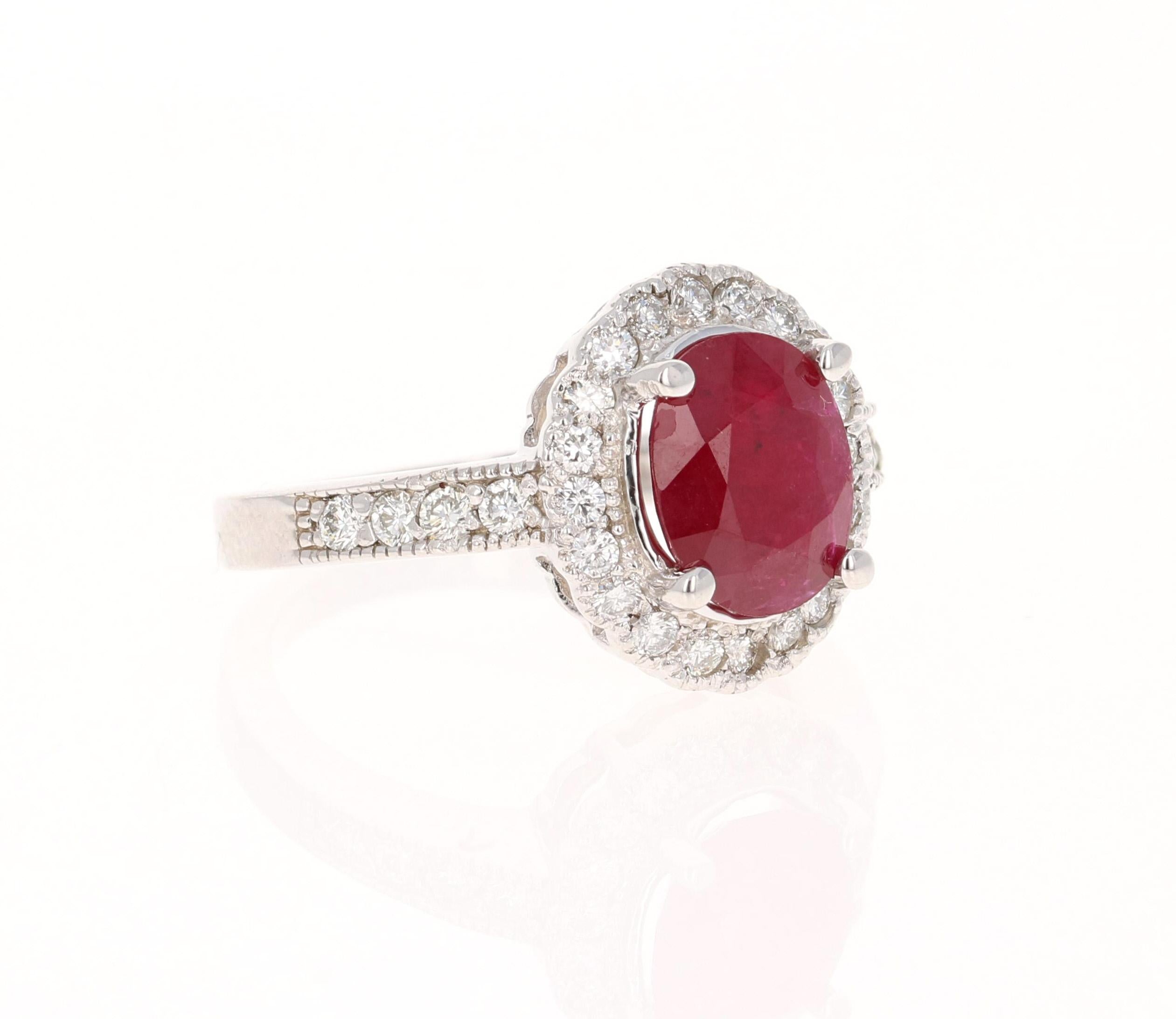 Stunning Ruby Diamond Ring with a 2.45 Carat Oval Cut Ruby and 28 Round Cut Diamonds that weigh 0.54 carats. The total carat weight of the ring is 2.99 carats. (Clarity: VS, Color: H)

The origins of the Ruby are from Mozambique, Africa. The ruby