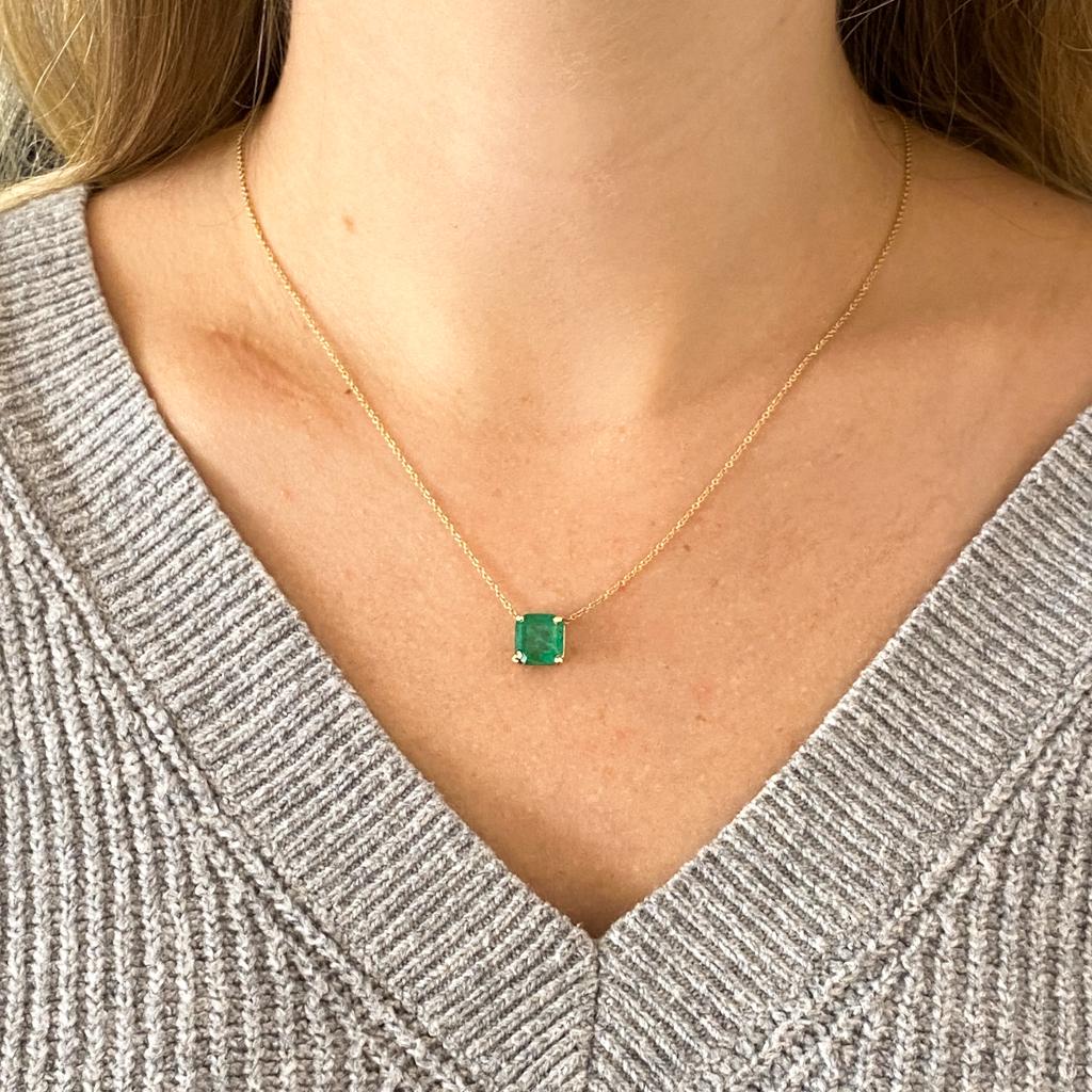 This gorgeous emerald is ready to make a statement on your neck. She's large and fabulous at 2.99 carats! This incredible necklace looks great alone, or stacked with your other favorite layers. Made in all 14 karat gold with a four prong basket with