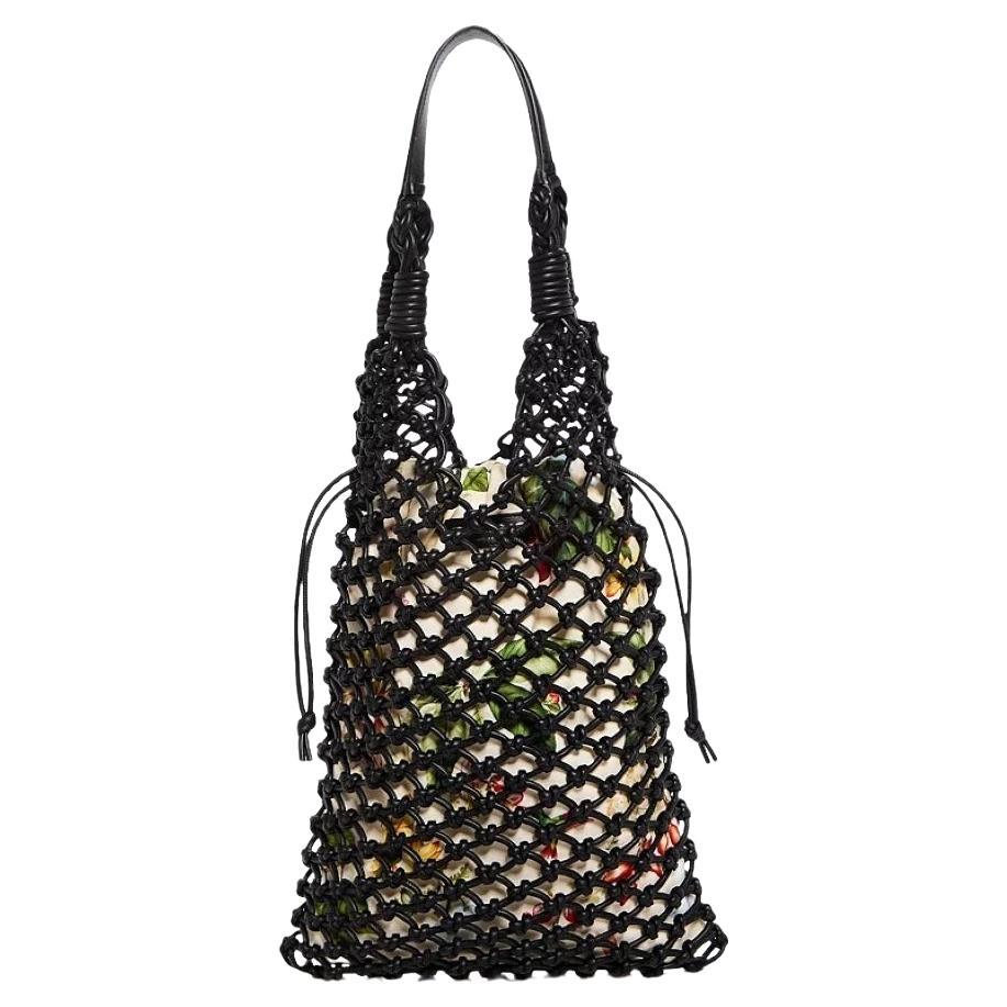 Oscar De La Renta
Brand New With Tags & Dust Cover
Spring 2024
$2990
Large

Inspired by the season's abundance of florals, this knotted tote is crafted from black Saffiano leather and features a removable heavy weight canvas pouch

Shoulder Strap