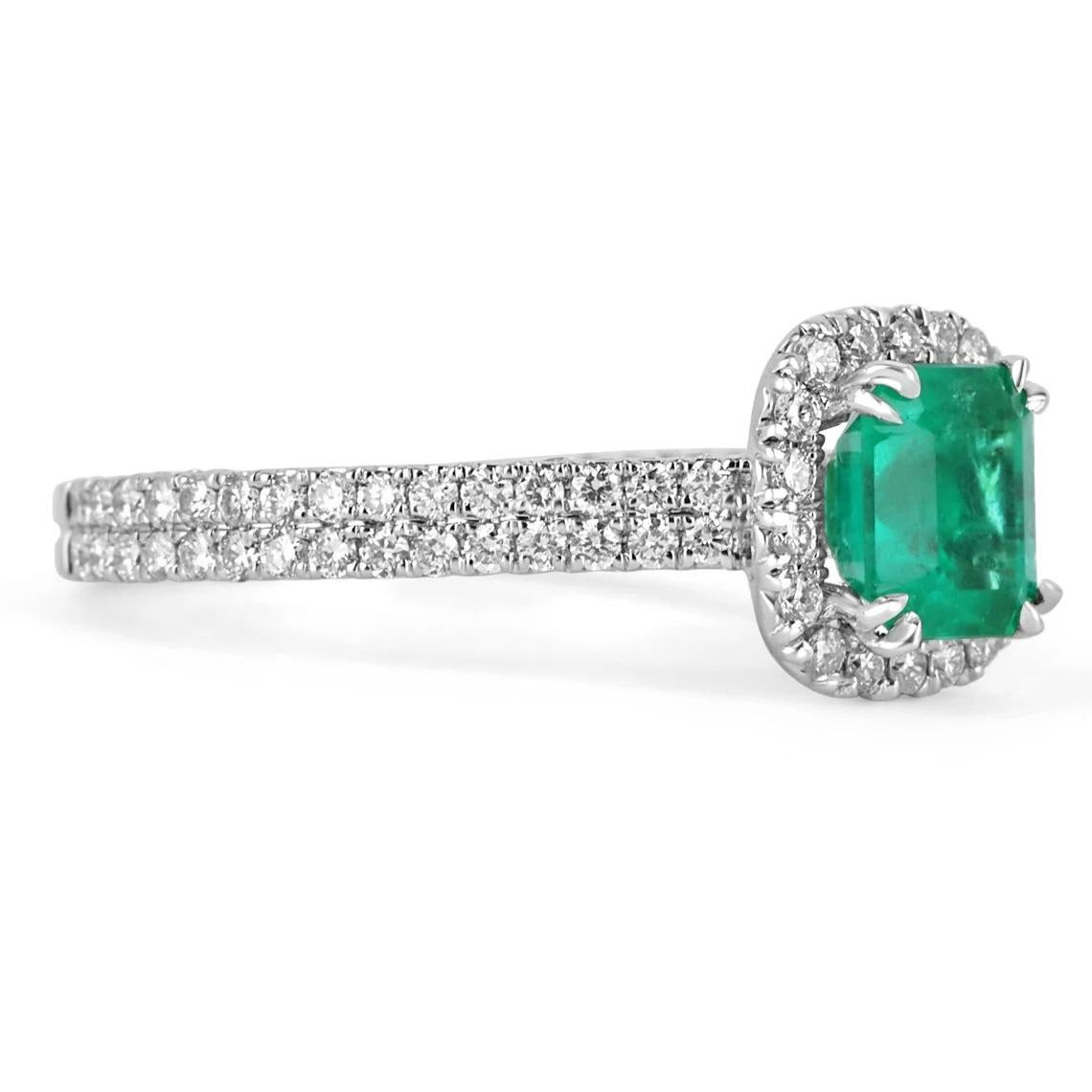 An exquisite AAA emerald and diamond engagement/right-hand ring. The gorgeous setting lets sit an excellent quality, earth-mined, natural emerald with beautiful color and excellent-very good eye clarity. Near colorless diamonds halo around the