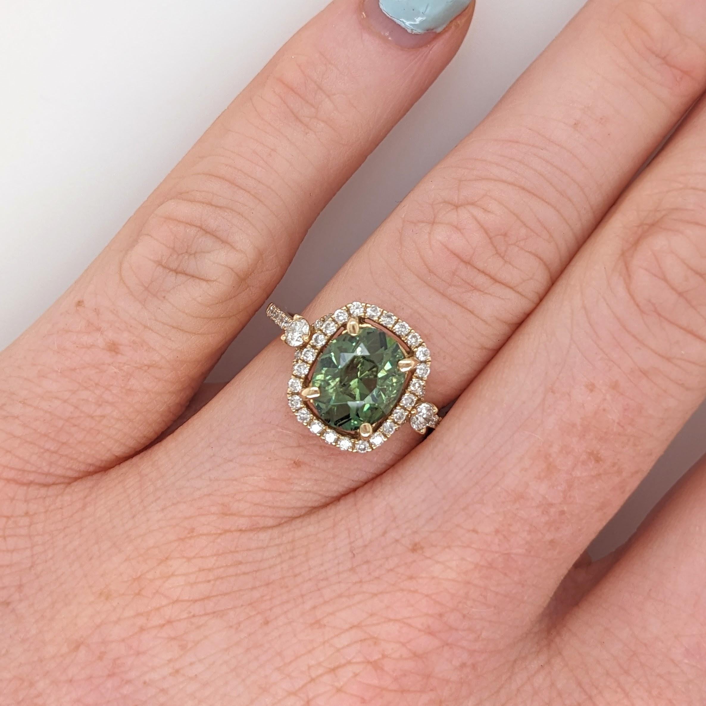 Presenting NNJ Designs' Summer Collection! 

This beautiful estate ring features a 2.91 carat cushion cut Demantoid gemstone with natural earth mined diamonds set in solid 14K gold.

Specifications

Item Type: Ring
Center Stone: Demantoid
Treatment: