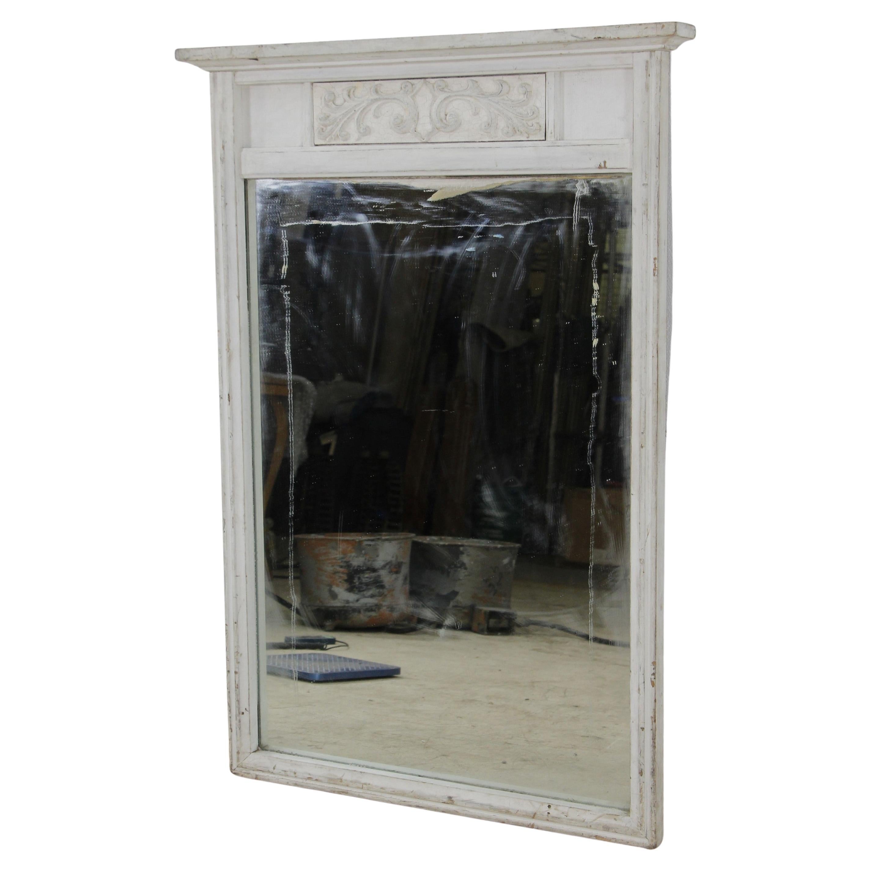 20th Century wood mirror with a carved floral design at the top. Original white finish. Please note, this item is located in our Scranton, PA location.