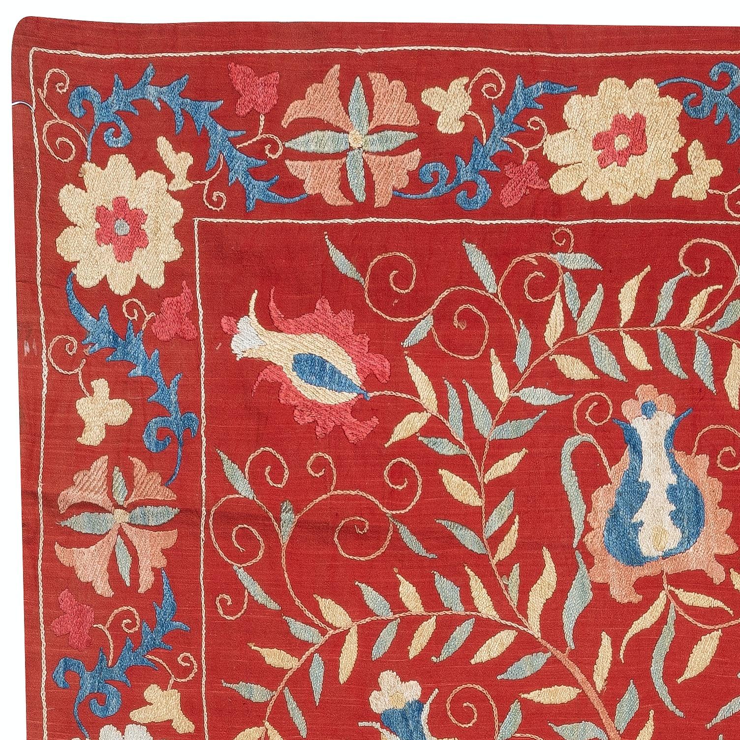 Introducing our exquisite new suzani hand embroidered wall hanging, a captivating piece that combines ancient craftsmanship with modern artistry. This embroidered cloth is not just a suzani throw, but a remarkable suzani wall hanging that will