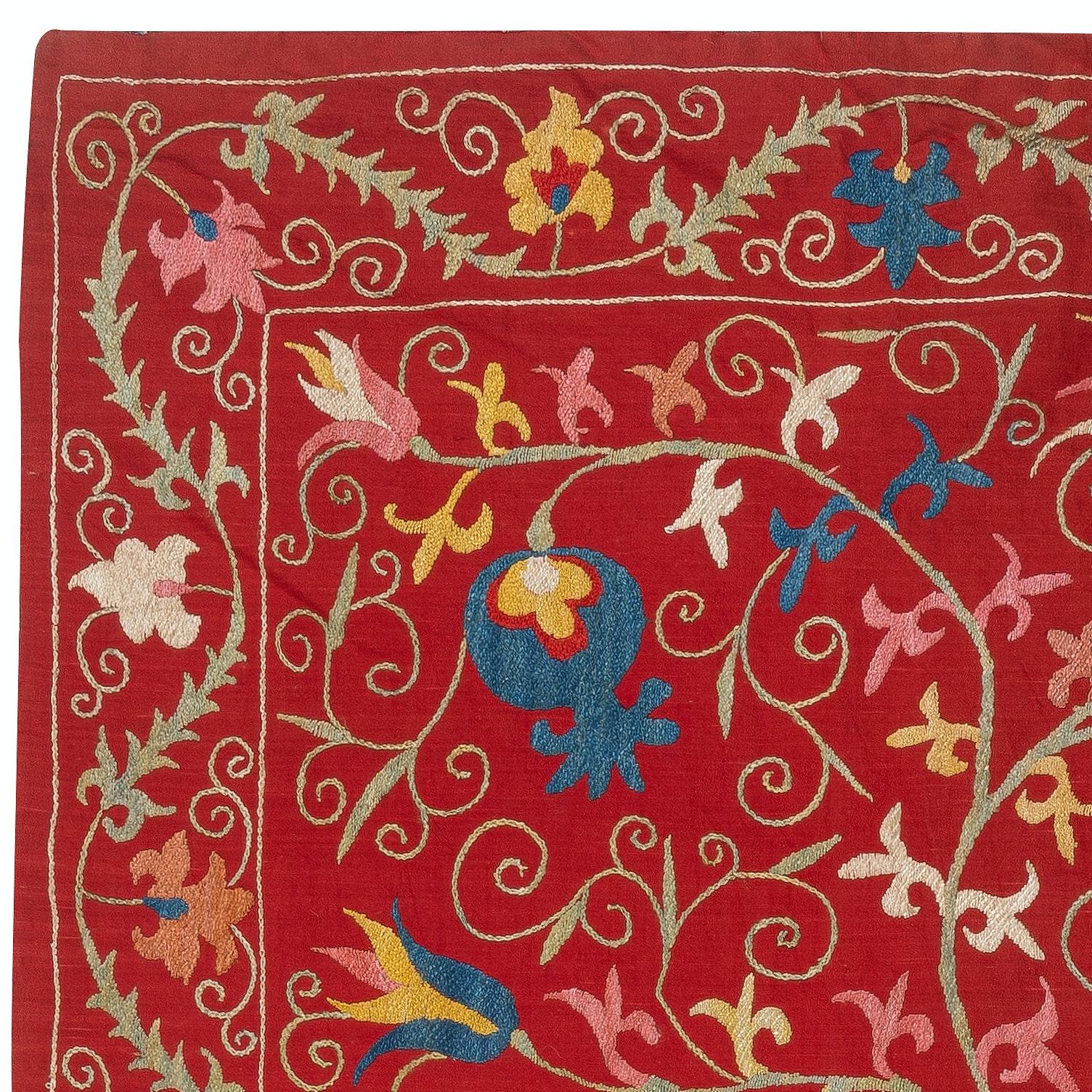 Introducing our exquisite new suzani hand embroidered wall hanging, a captivating piece that combines ancient craftsmanship with modern artistry. This embroidered cloth is not just a suzani throw, but a remarkable suzani wall hanging that will