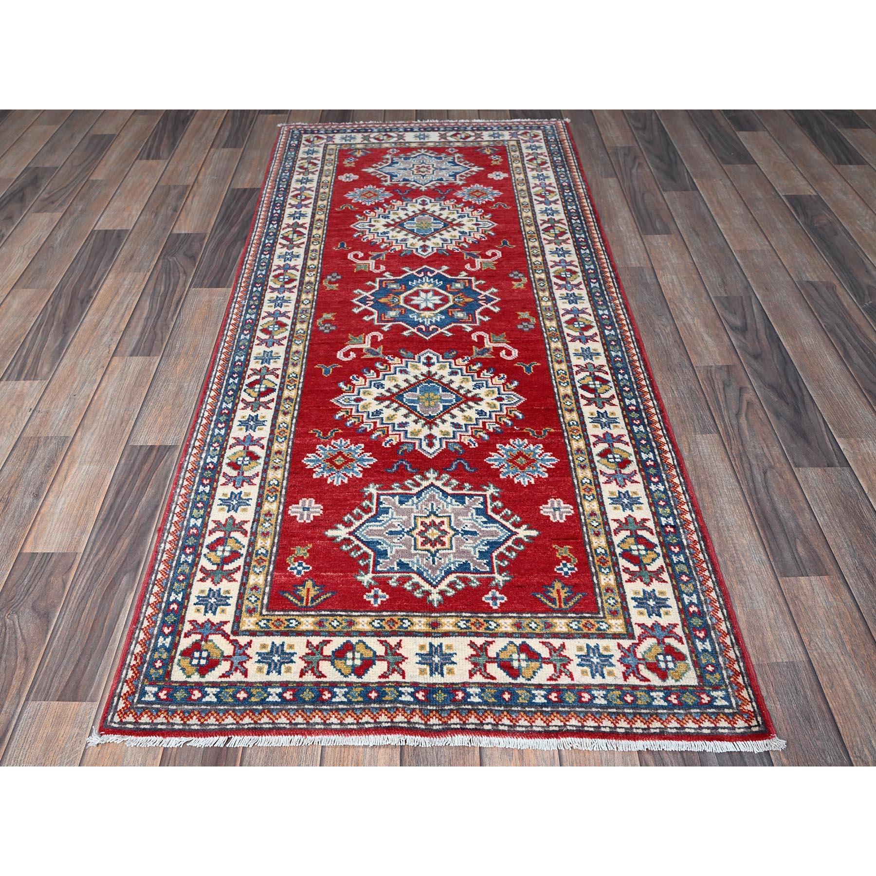 Crimson Red, Kazak with Geometric Medallions Design, Soft and Vibrant Wool, Hand Knotted, Vegetable Dyes, Denser Weave, Runner, Oriental Rug
Primary materials: Wool
Latex: No Pile 
height: 0.25 Inches
Style: Traditional
Primary color: Red
Secondary