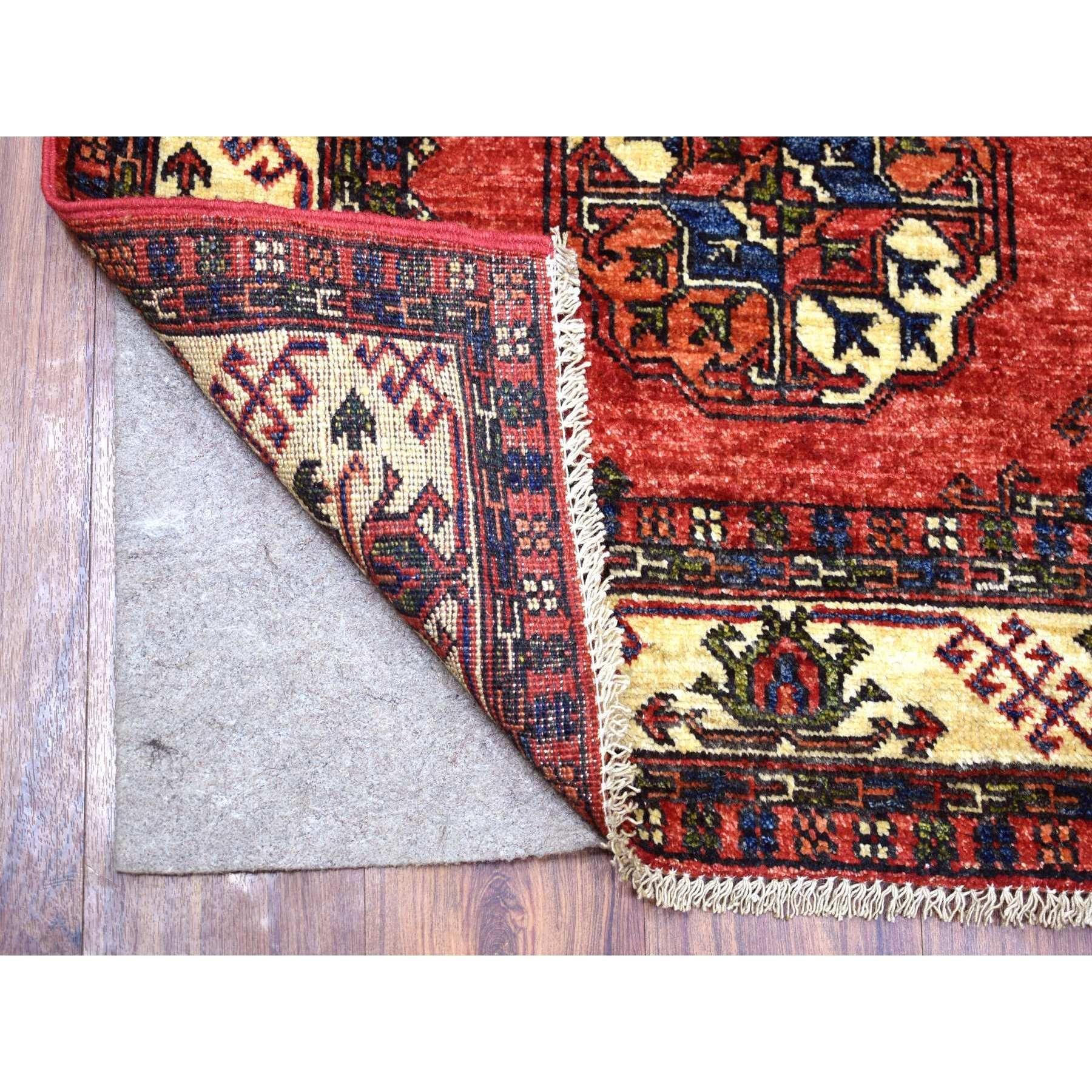 This is a truly genuine one-of-a-kind Coral Red, Hand Knotted Turkeman Ersari with Elephant Feet Design, Natural Dyes Densely Woven Pure Wool, Runner Oriental Rug. It has been Knotted for months and months in the centuries-old weaving craftsmanship