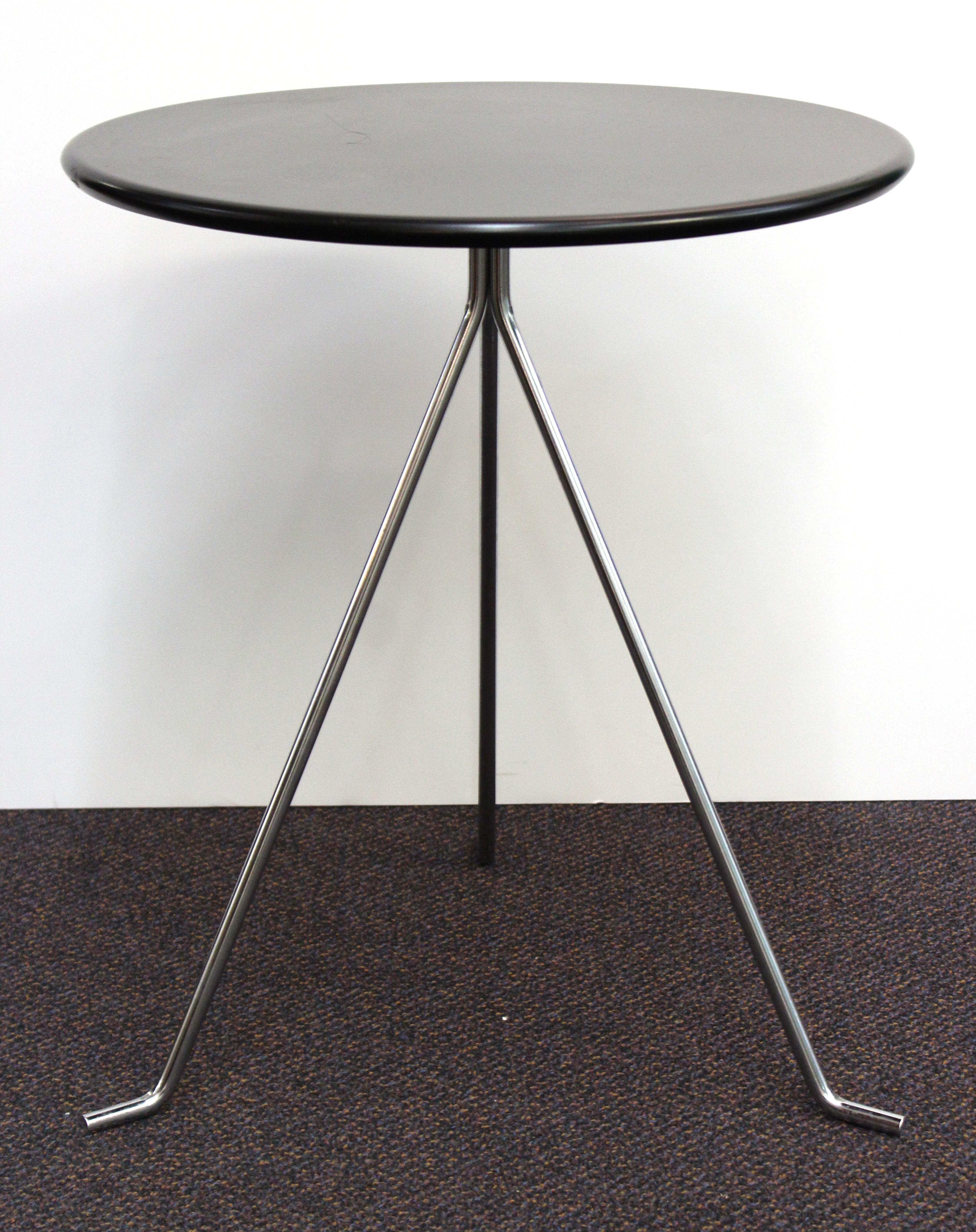 Danish modern round metal table on tripod legs, made by 2B in Denmark during the late 20th century. The three legs can be taken off for easy storage of the table. In great vintage condition with some wear to the tabletop.

2 items available.