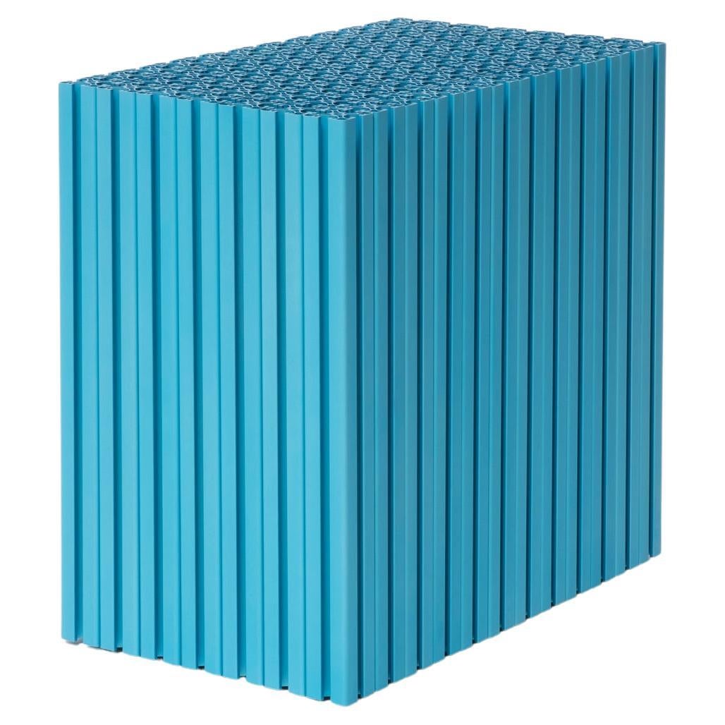 Sculptural Cyan Anodized Aluminum Side Table / Plinth by Antoni Pallejà Studio

This striking cyan side table or plinth is crafted from anodized aluminum blocks, produced by assembling standard structural units into a monolithic form. Designed by
