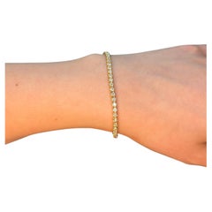 Bracelet tennis à griffes en or jaune 14 carats avec diamants 2 carats par Gem Jewelers Co.