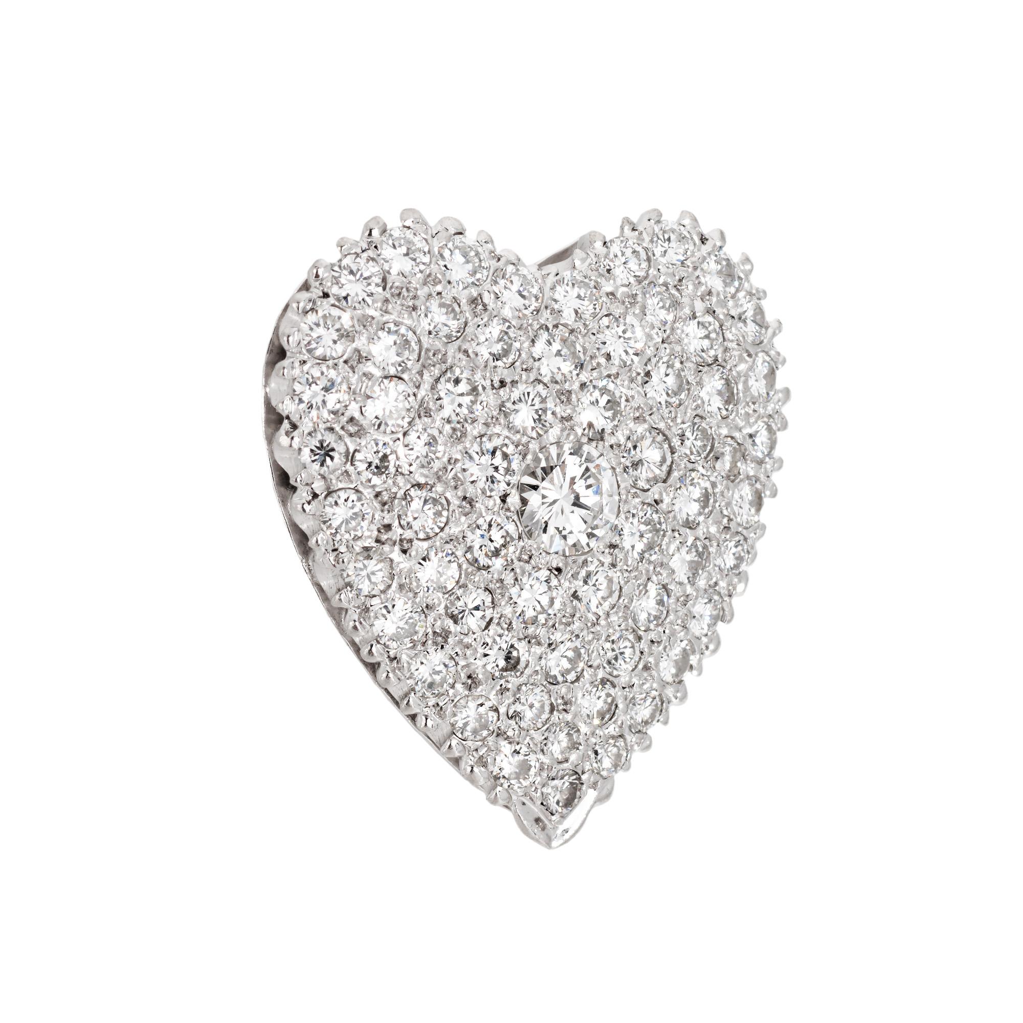Finely detailed vintage diamond heart pendant crafted in 900 platinum (circa 1950s to 1960s).  

Round brilliant cut diamonds total an estimated 2 carats (estimated at G-H color and VS2-SI1 clarity).  

The charming heart pendant is set with bright