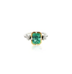 2ct Emerald and Diamond Forget Me Knot ring in Platinum and 22k gold