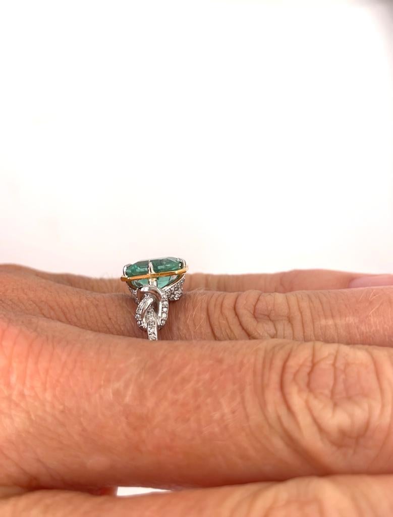 Emerald Cut 2ct Emerald and diamond Forget Me Knot ring in platinum and 22k gold