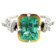 2ct Emerald and diamond Forget Me Knot ring in platinum and 22k gold