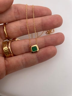 2ct emerald bezel set pendant with slider chain in 18k gold
