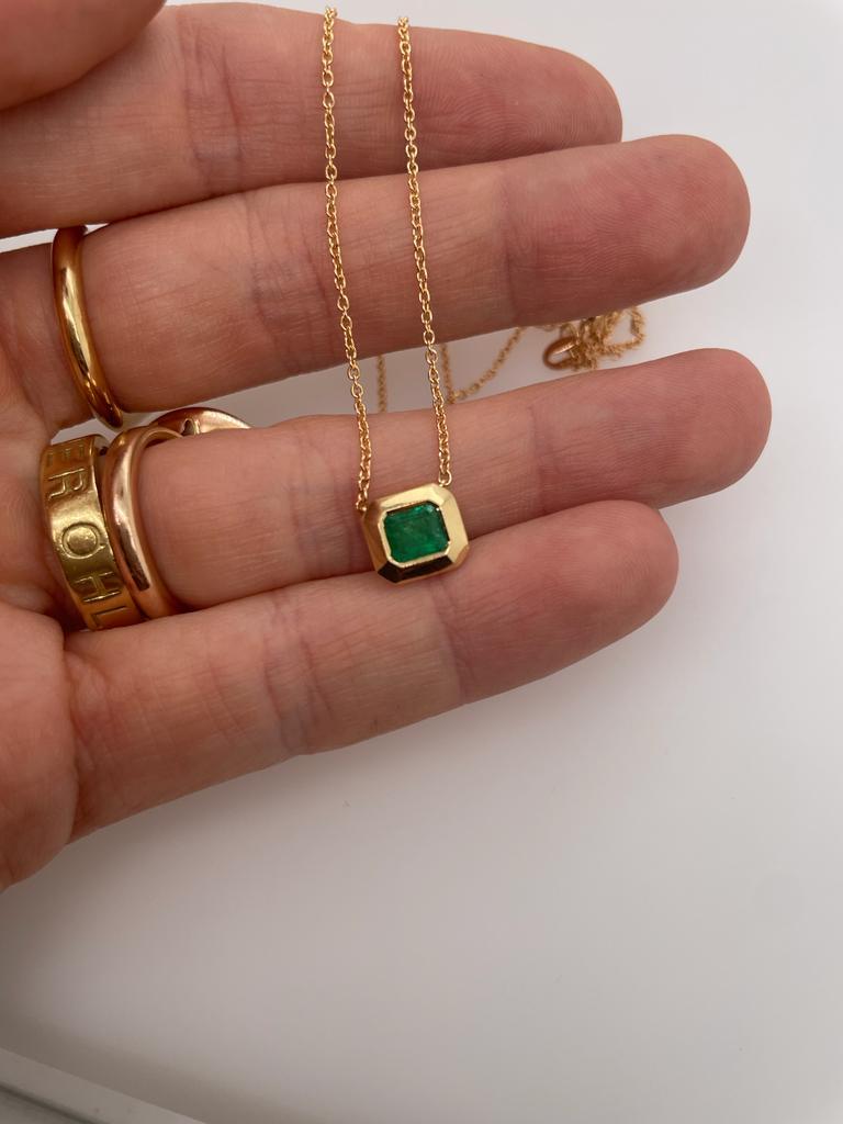 Artisan 2ct emerald bezel set pendant with slider chain in 18k gold  For Sale