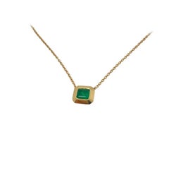 2ct emerald bezel set pendant with slider chain in 18k gold 