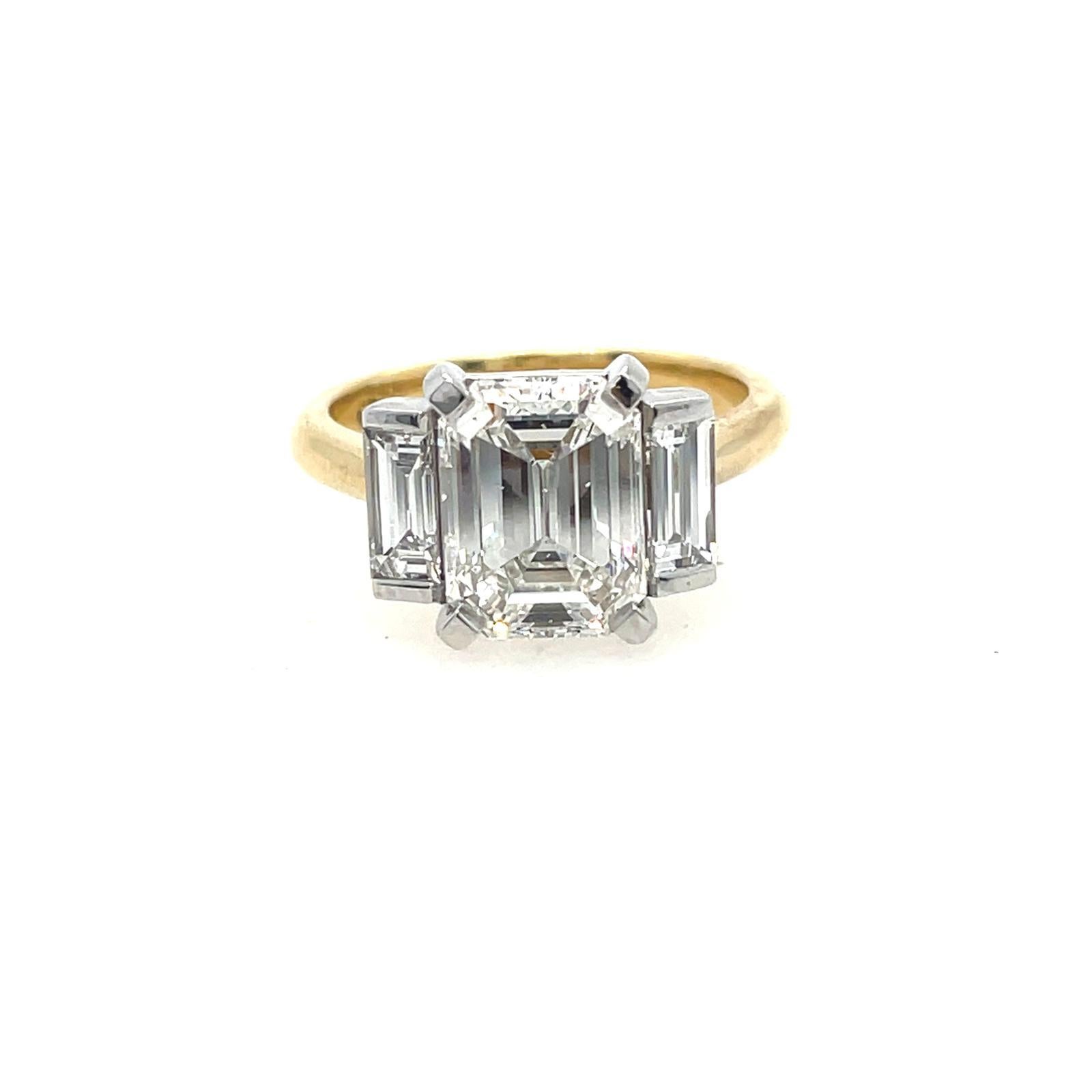 Artisan 2ct Emerald cut and baguette three stone style classic ring in 18k gold  For Sale