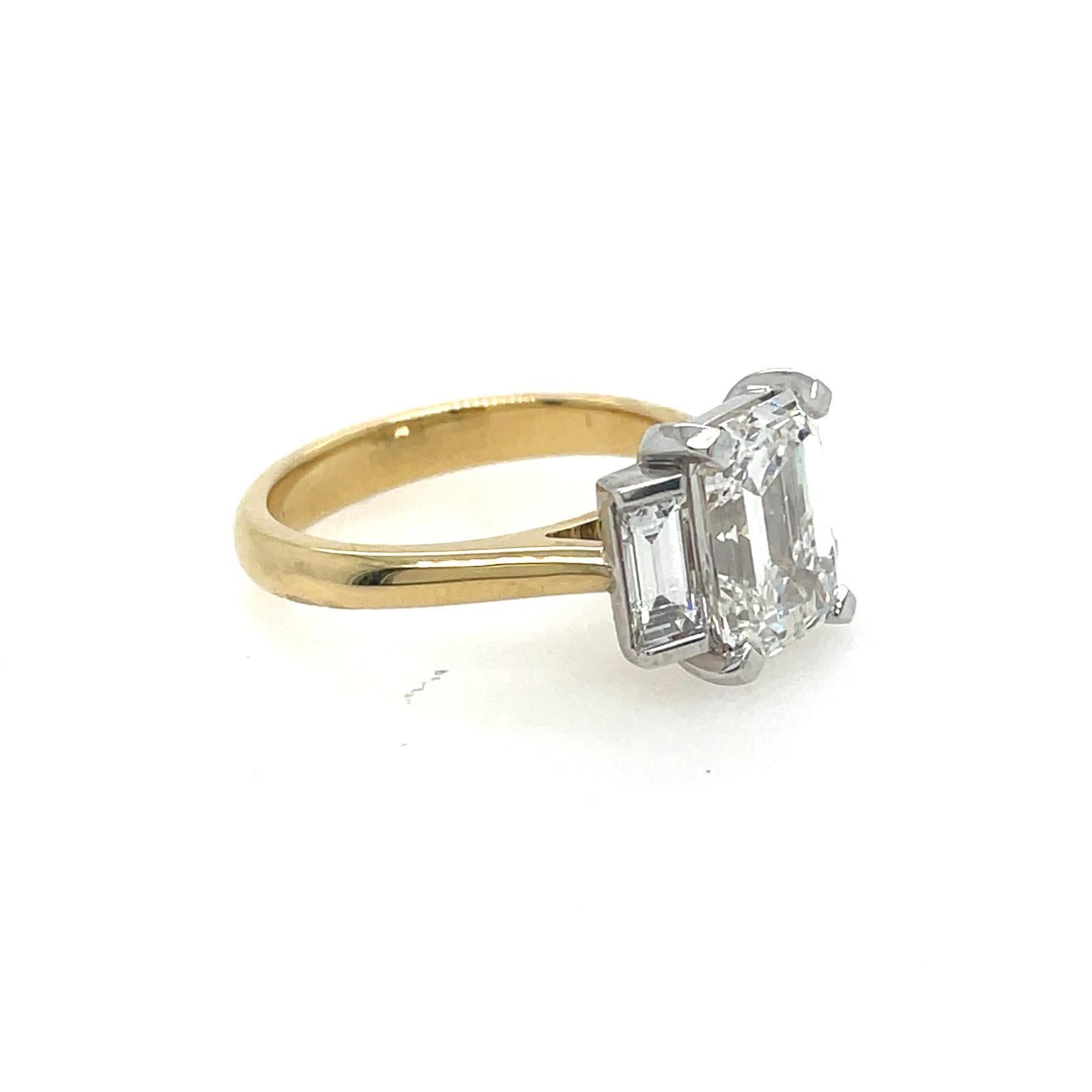 Artisan 2ct Emerald cut and baguette three stone style classic ring in 18k gold  For Sale