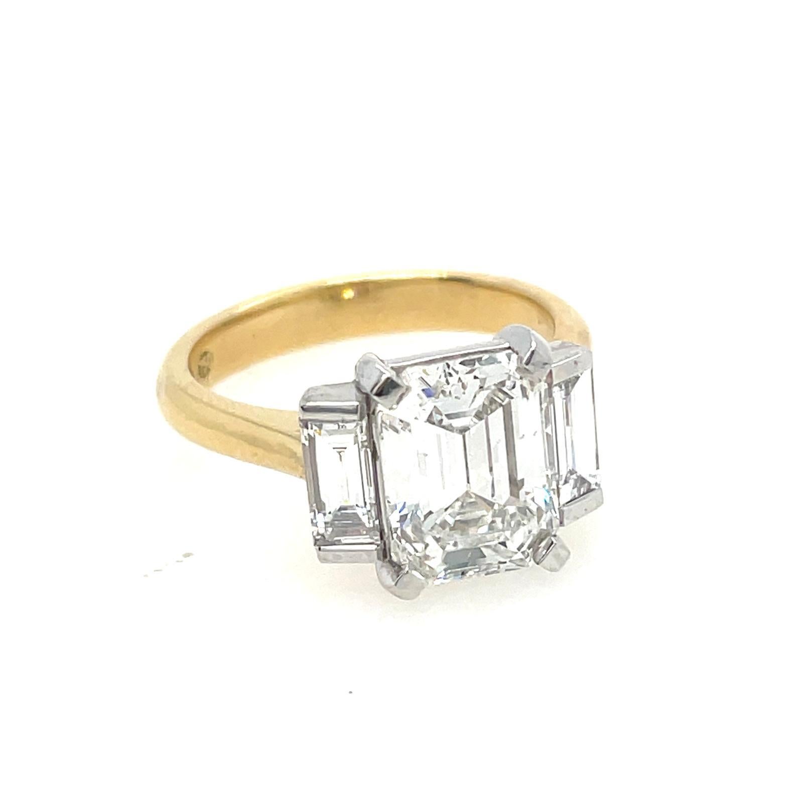 Baguette Cut 2ct Emerald cut and baguette three stone style classic ring in 18k gold  For Sale