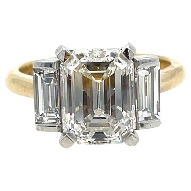 2ct Emerald cut and baguette three stone style classic ring in 18k gold 