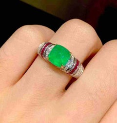 2CT Emerald Ring 18K Gold with Ruby Bezel & 0.20CT Diamond Band