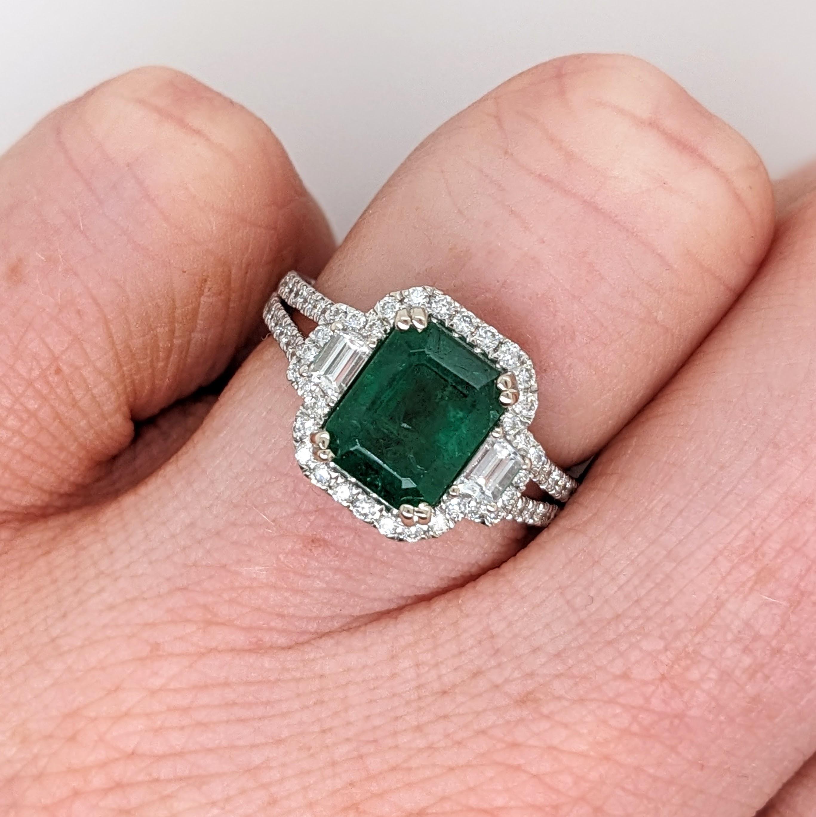 This statement ring has a vintage style emerald surrounded by a natural halo of diamonds and baguette diamond accents. This ring is made with solid 14k gold and can be customized to fit your needs! This ring also makes a beautiful May birthstone