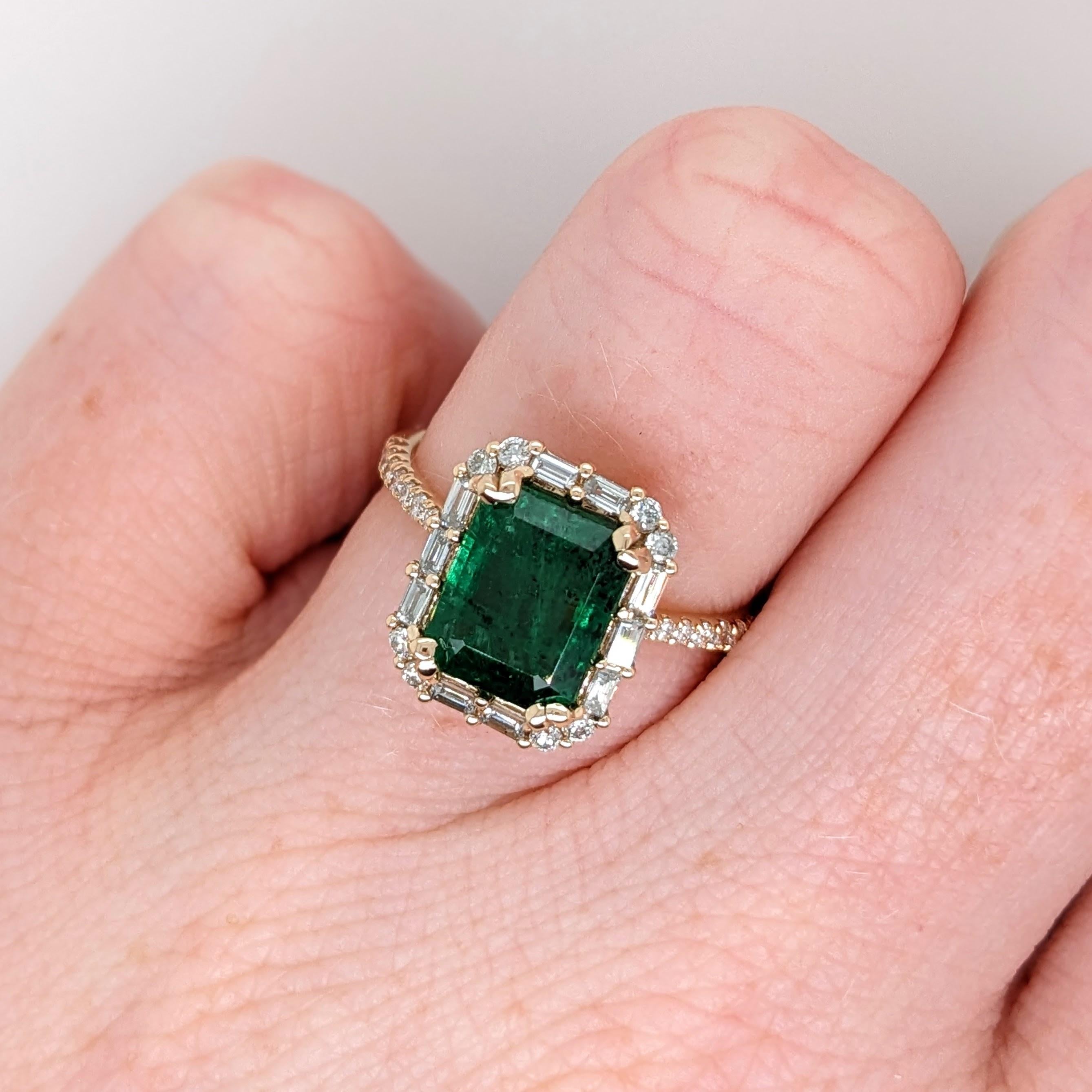 This statement ring has a vintage style Emerald surrounded by natural earth mined round and baguette diamond accents. This ring is made with solid 14k yellow gold and can be customized to fit your needs! This ring also makes a beautiful May