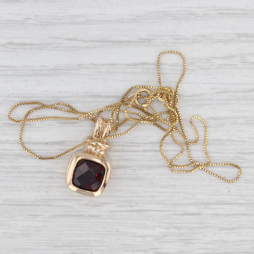 Gemstone Information:
- Natural Garnet -
Carats - 2ct
Cut - Checkerboard Cushion
Color - Dark Red

Metal: 14k Yellow Gold
Weight: 4.5 Grams
Stamps: 14k
Chain Style: Box Chain
Closure: Spring Ring Clasp
Length: 18 1/4