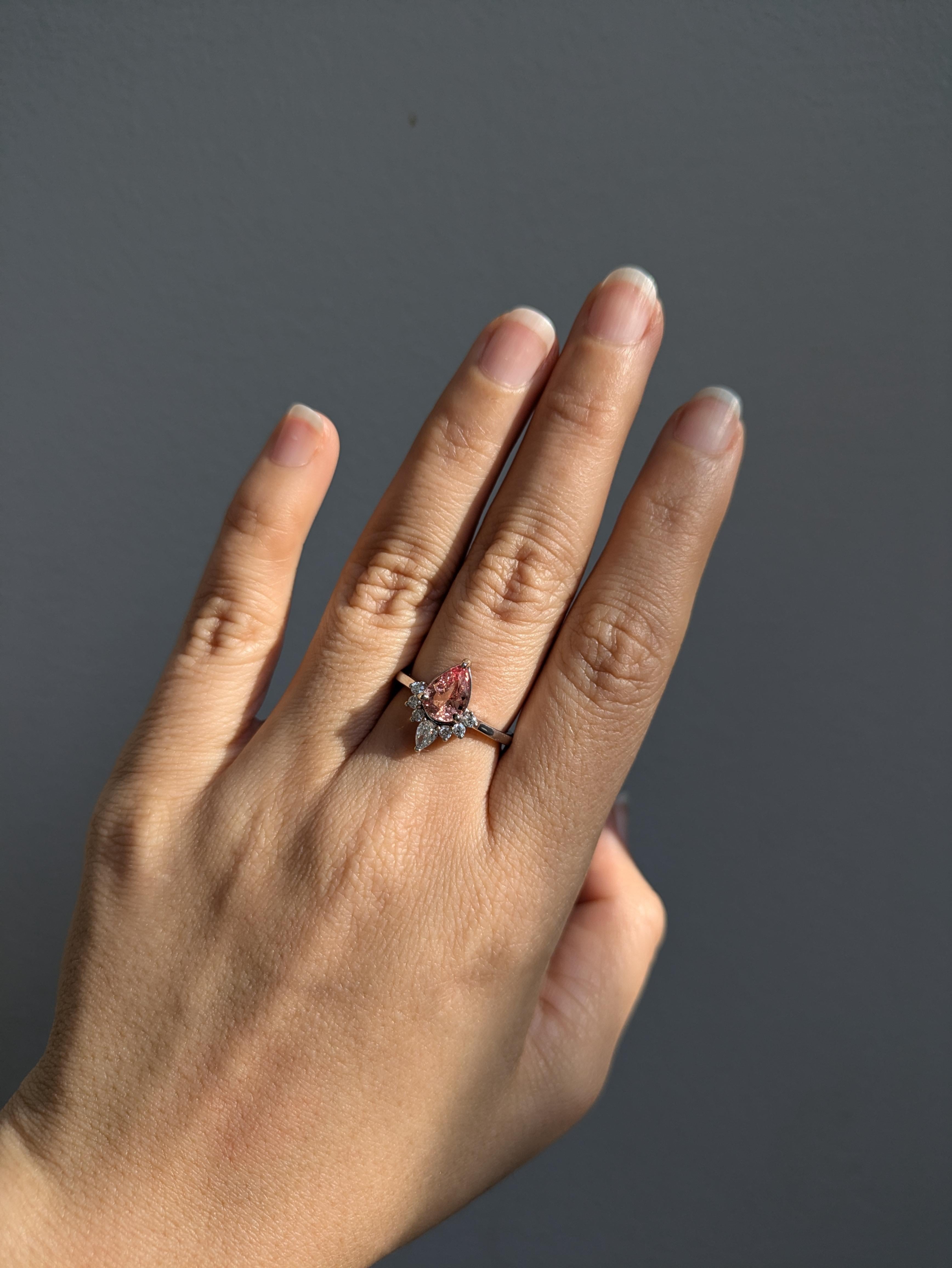 This stunning ring showcases a 1.96 carat oval Imperial Topaz gemstone, elegantly surmounted by natural earth mined diamonds set in solid 14K gold. This Imperial Topaz ring makes a beautiful November birthstone gift for your loved ones!

**We offer