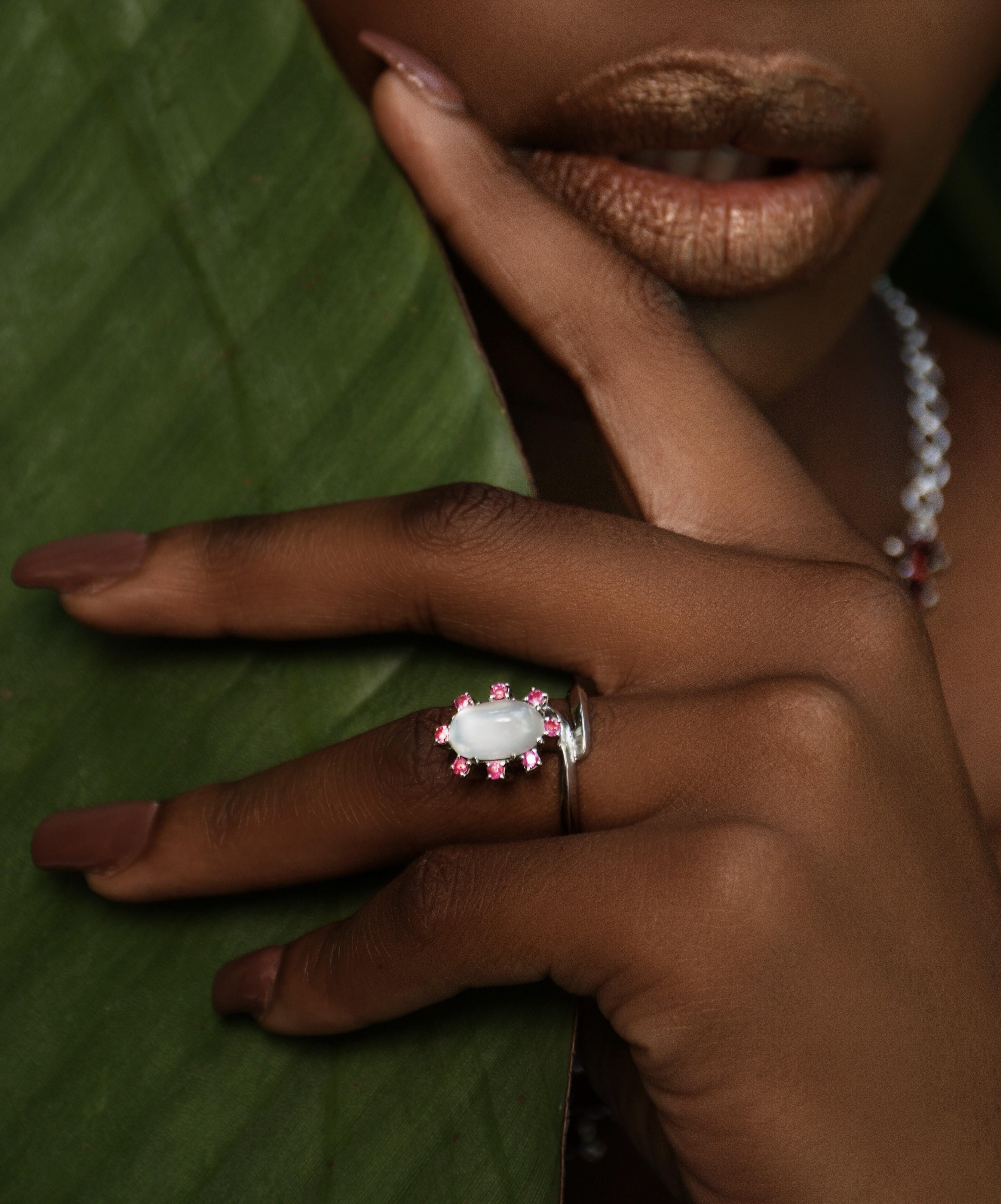 Introducing our exquisite 2ct  Moonstone and Pink Ruby Platinum Silver Cocktail Ring, a true statement piece for those special occasions. This ring features a captivating 2ct Moonstone, known for its enchanting play of light. The Moonstone is