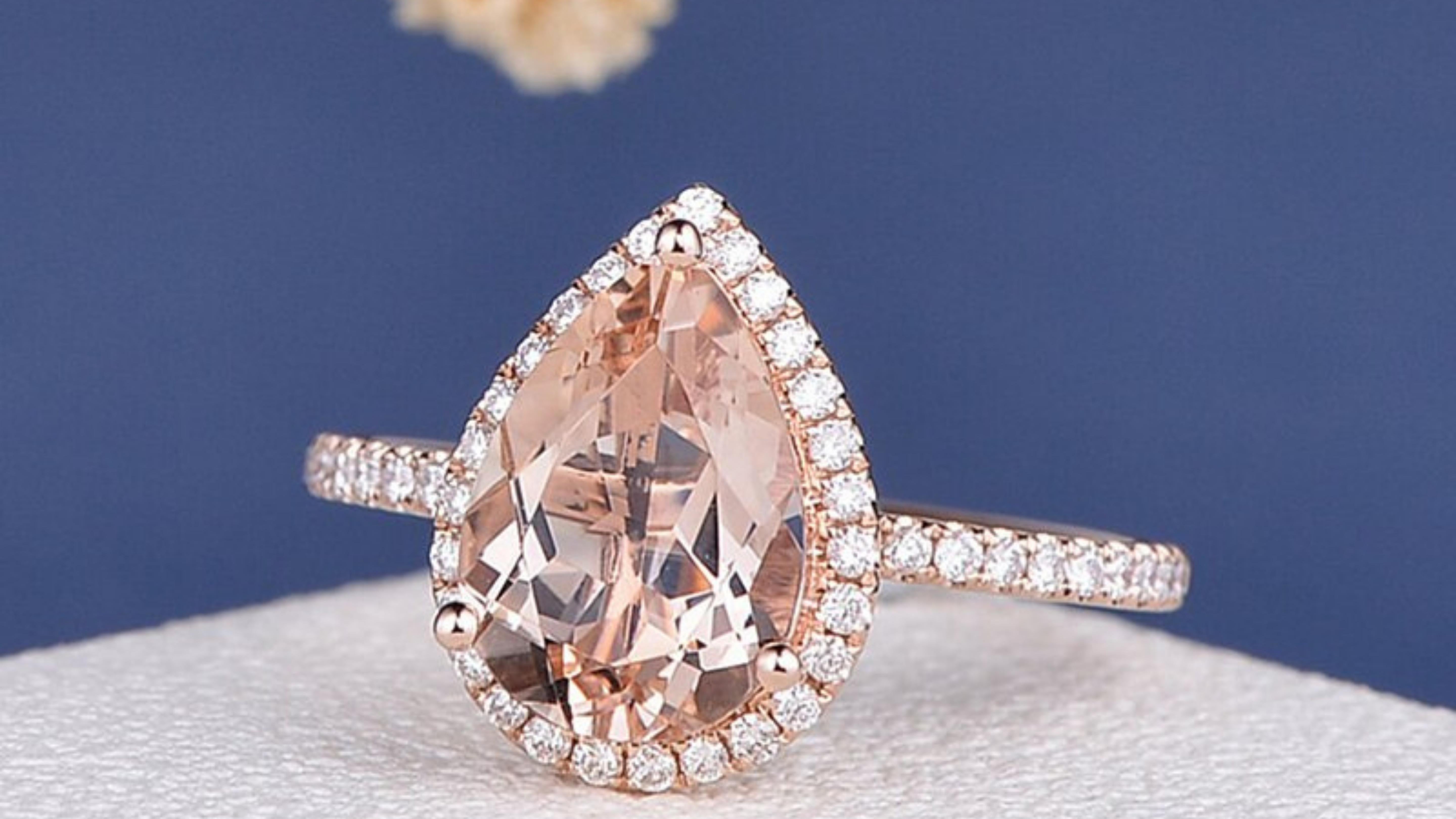 This Pink Morganite Ring stands out with the moissanite stones set in 14k Rose Gold 

Following the discovery of a new locality for rose beryl in Madagascar in 1910, George Kunz proposed the name morganite at a meeting of the New York Academy of