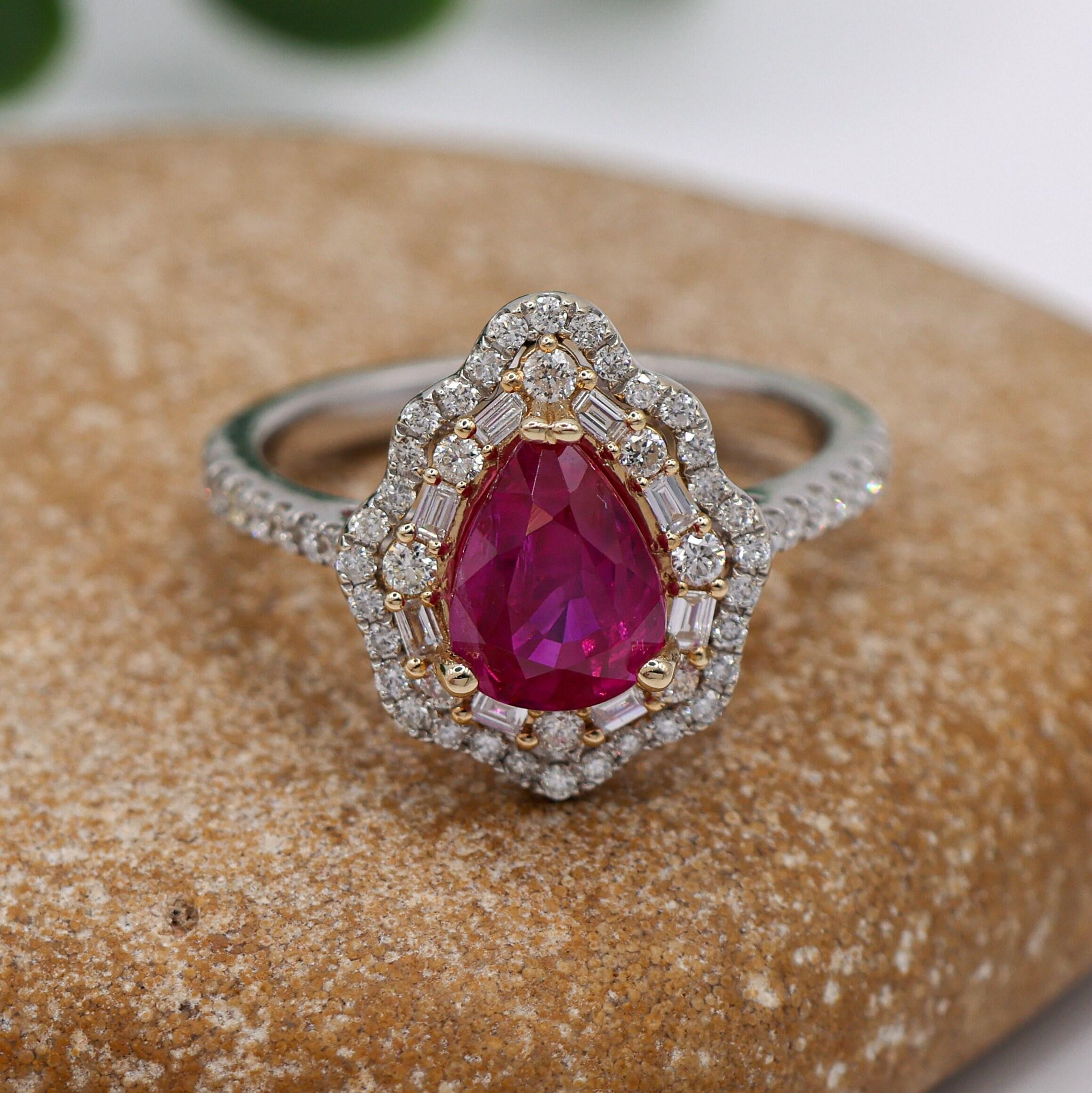 This stunning ring features a sparkling red Mozambizue ruby set in dual tone solid 14K rose and white gold with natural earth-mined diamonds. This statement ring makes for a stunning accessory to any look!

Specifications

Item Type: Ring
Center