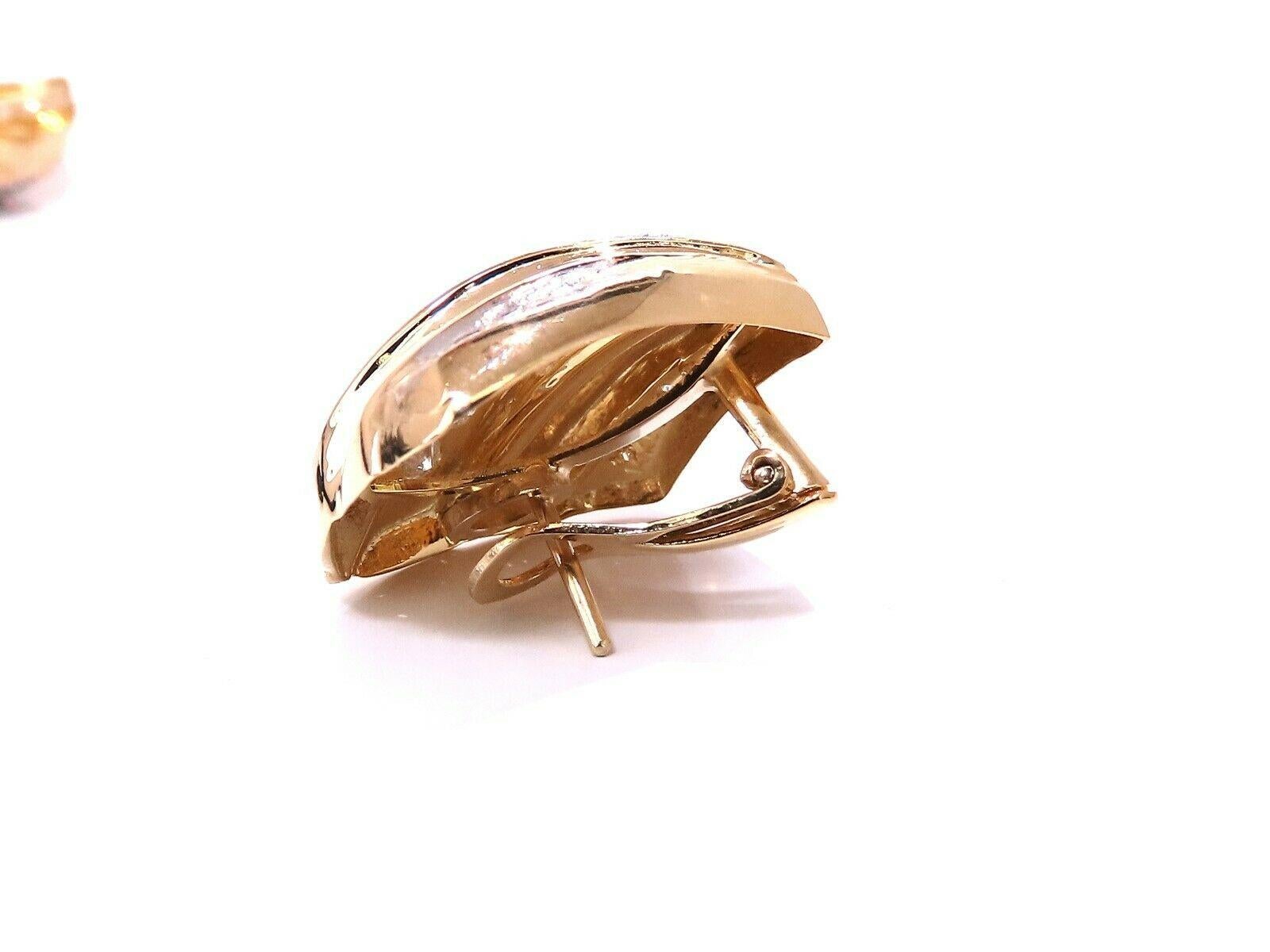 Shell form square shape diamond earrings.

2 carat natural round diamonds

G color vs2 clarity

14kt yellow gold 12g

Earring measure 20 x 20 mm

Depth: 8.6mm

Comfortable omega clip

$12,000 appraisal certificate to accompany