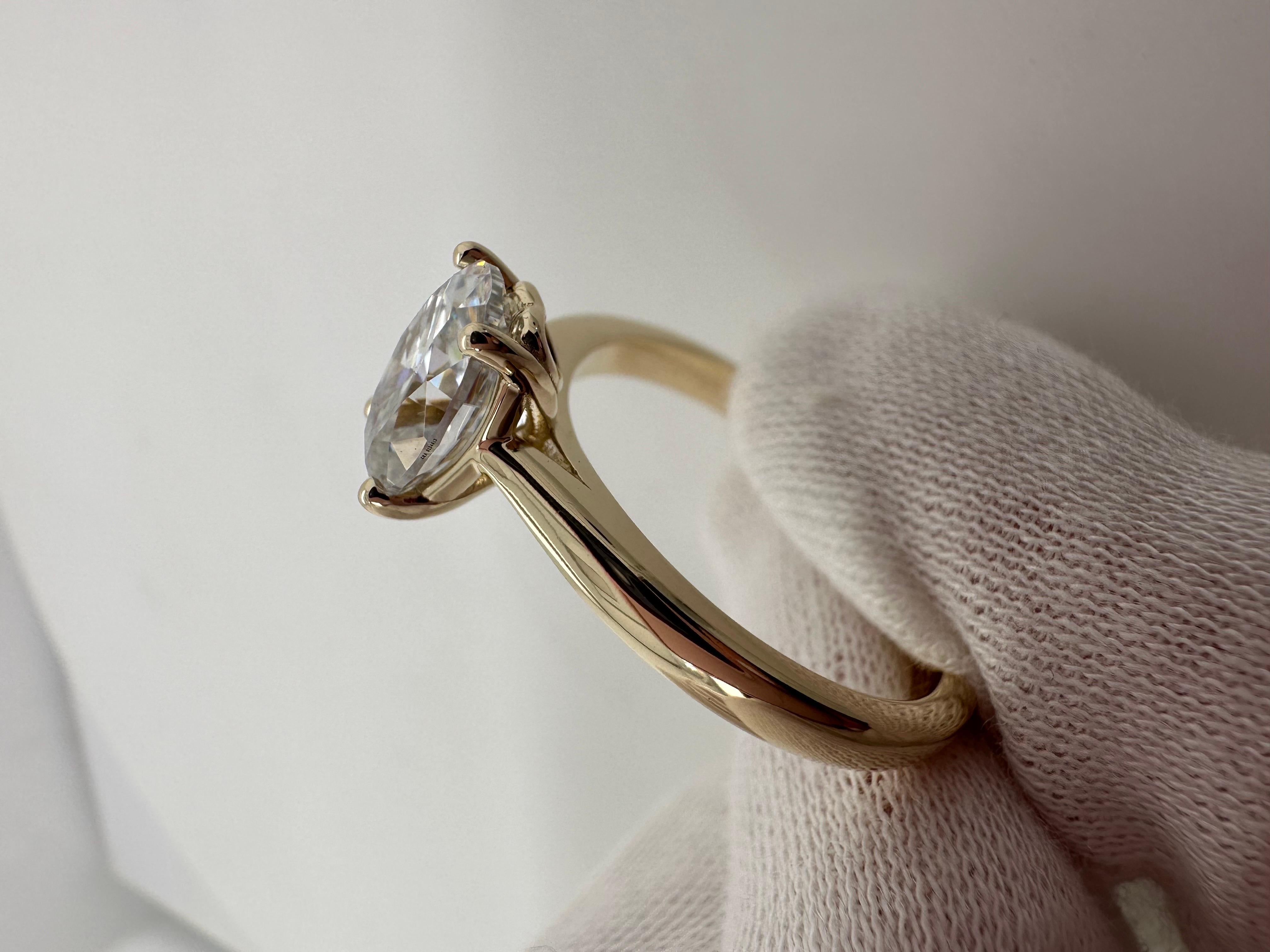 2ct oval moissanite certified VVS1 clarity and F color, made in 14KT yellow gold, simple elegant ring with a small heart on the setting.Handling time 6-7 days to get a certificate of authenticity in your name.

Certificate of authenticity comes with