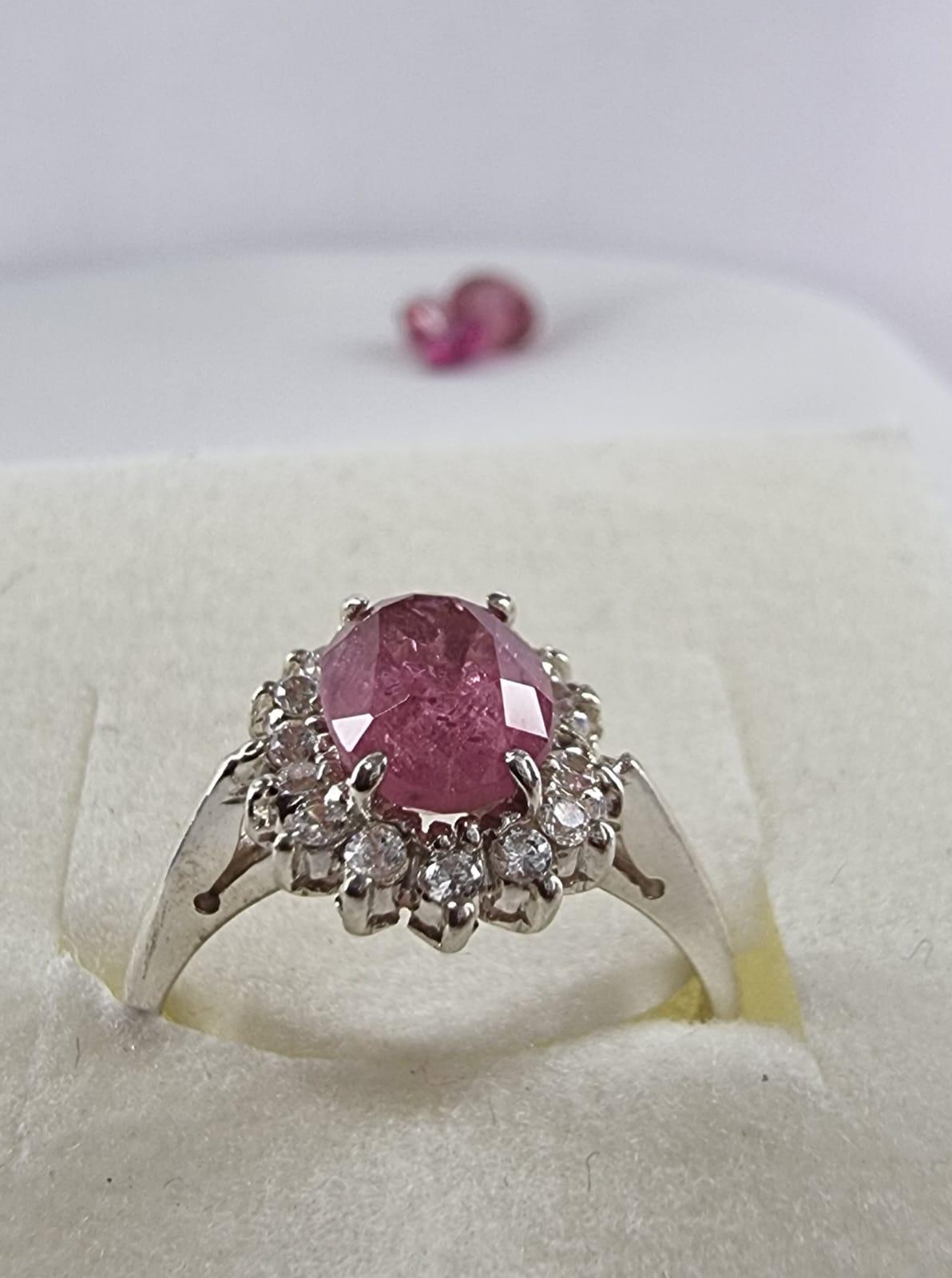 The oval-cut pink candied tourmaline is the centerpiece, radiating warmth and sophistication. The delicate silver band complements the gemstone beautifully, making it a perfect choice for special occasions or everyday wear.

Product