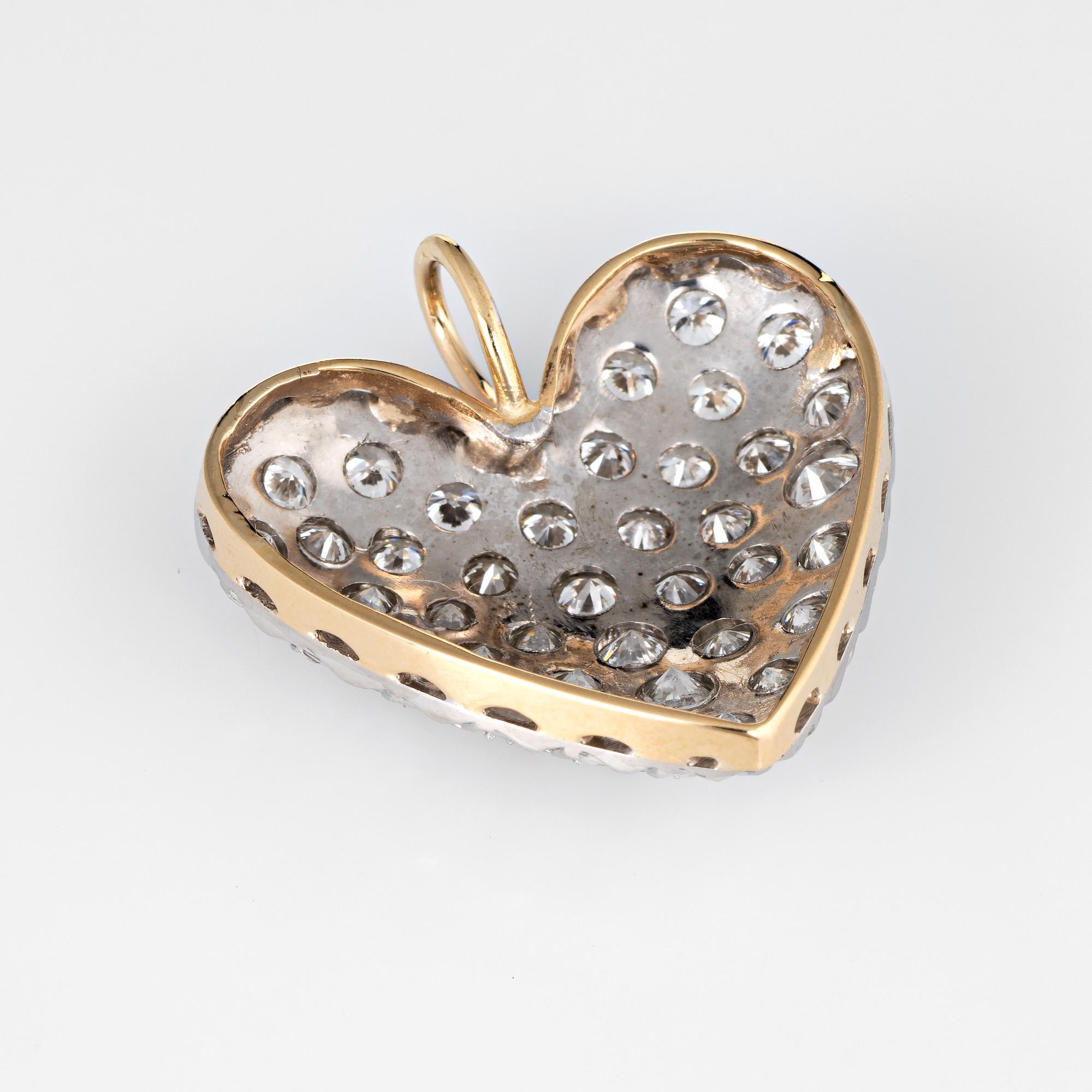 Finely detailed vintage pave diamond heart pendant crafted in 14k yellow & white gold.  

41 estimated 0.05 carat round brilliant cut diamonds are pave set into the heart and total an estimated 2.05 carats (estimated at G-H color and VS2 clarity).