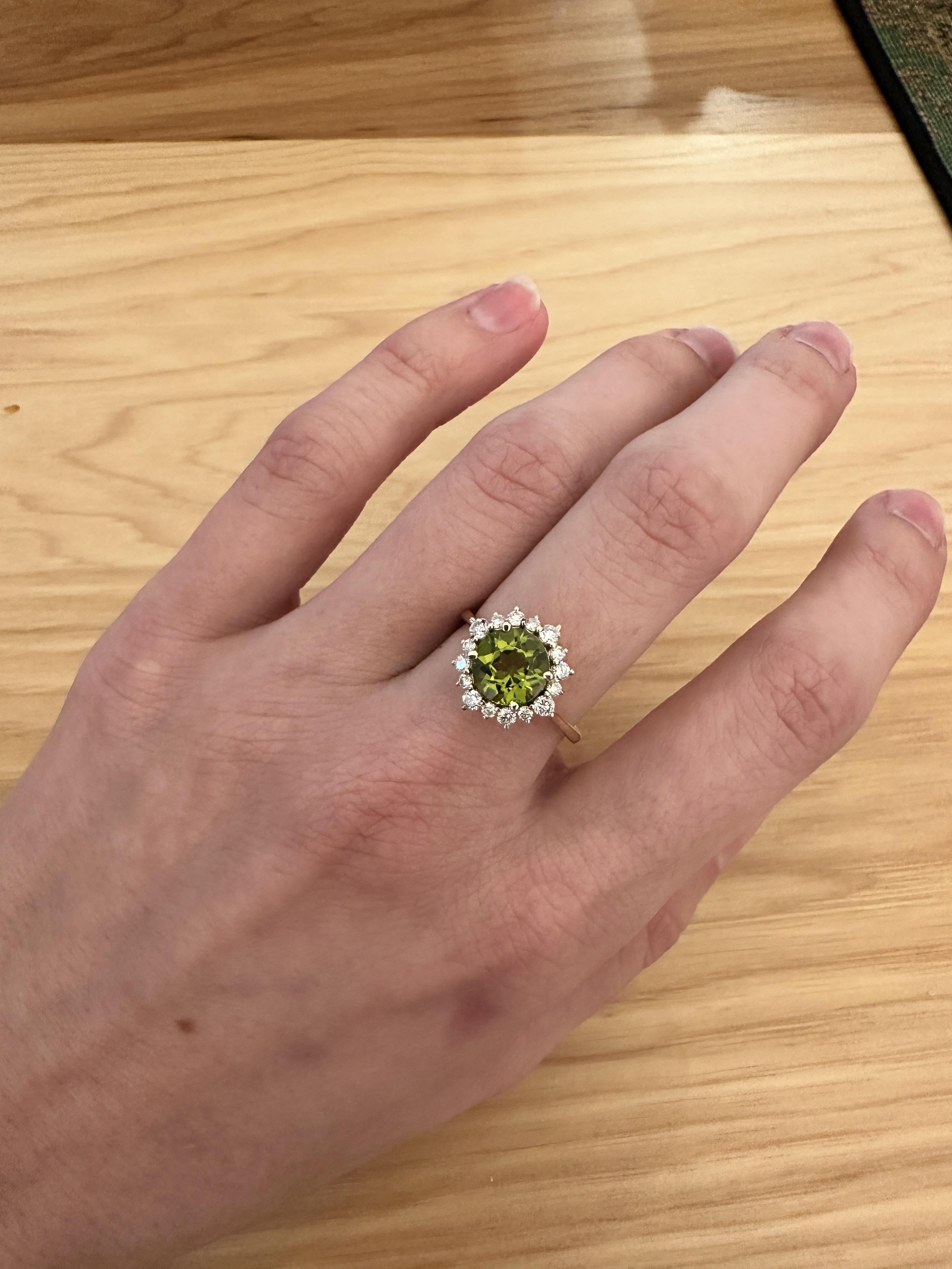 This beautiful ring features a 1.91 carat Peridot gemstone with natural earth mined diamonds in solid 14K yellow gold. This Peridot ring makes a lovely August birthstone gift for your loved ones!

**We offer complimentary resizing, message us the