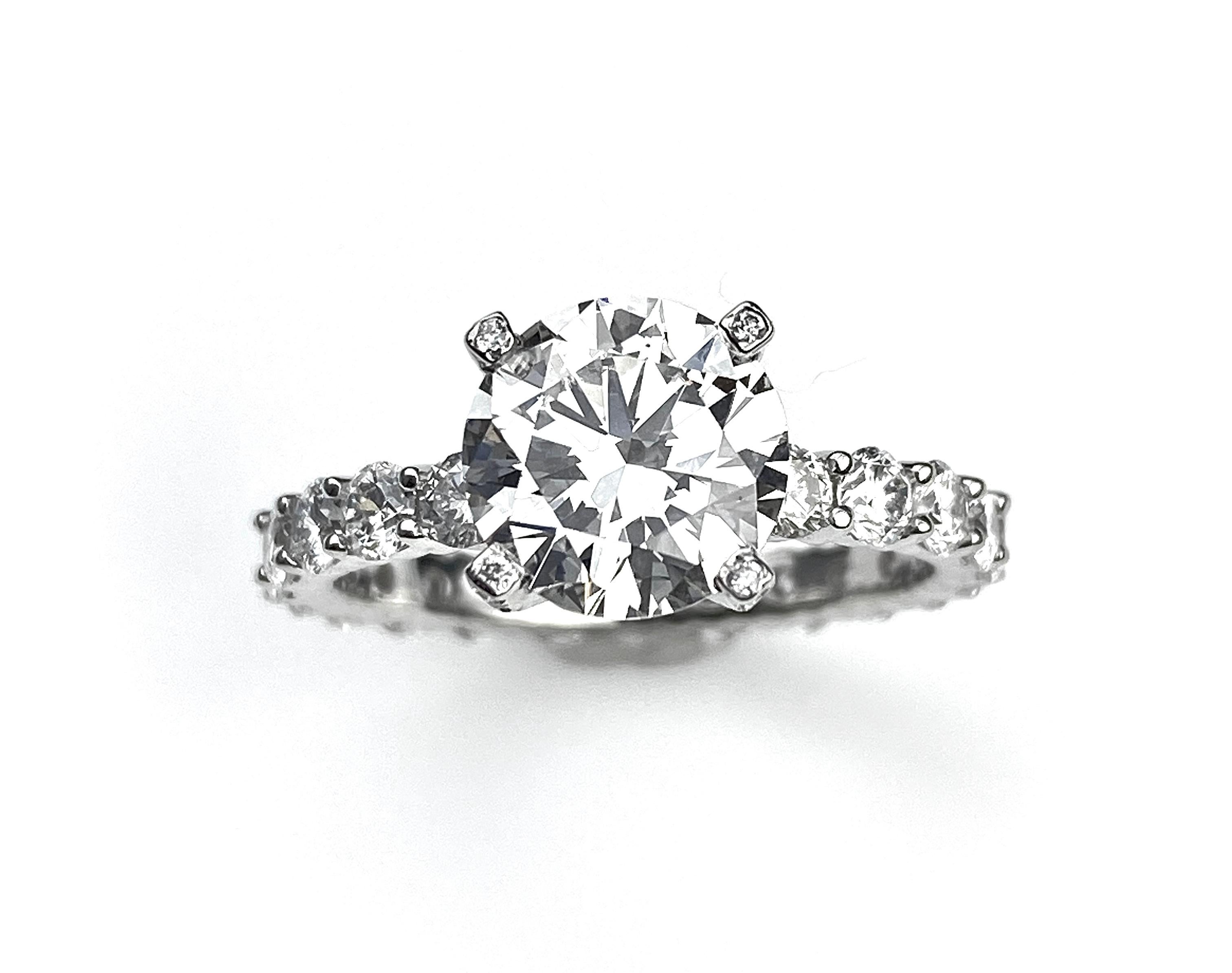 2.02ct I colour VS2 clarity, GIA#2127721422, round brilliant cut diamond engagement ring with 1.77ct total diamonds set in the gallery and full eternity all the way around. 18k white gold setting. Currently sized 6.5. 