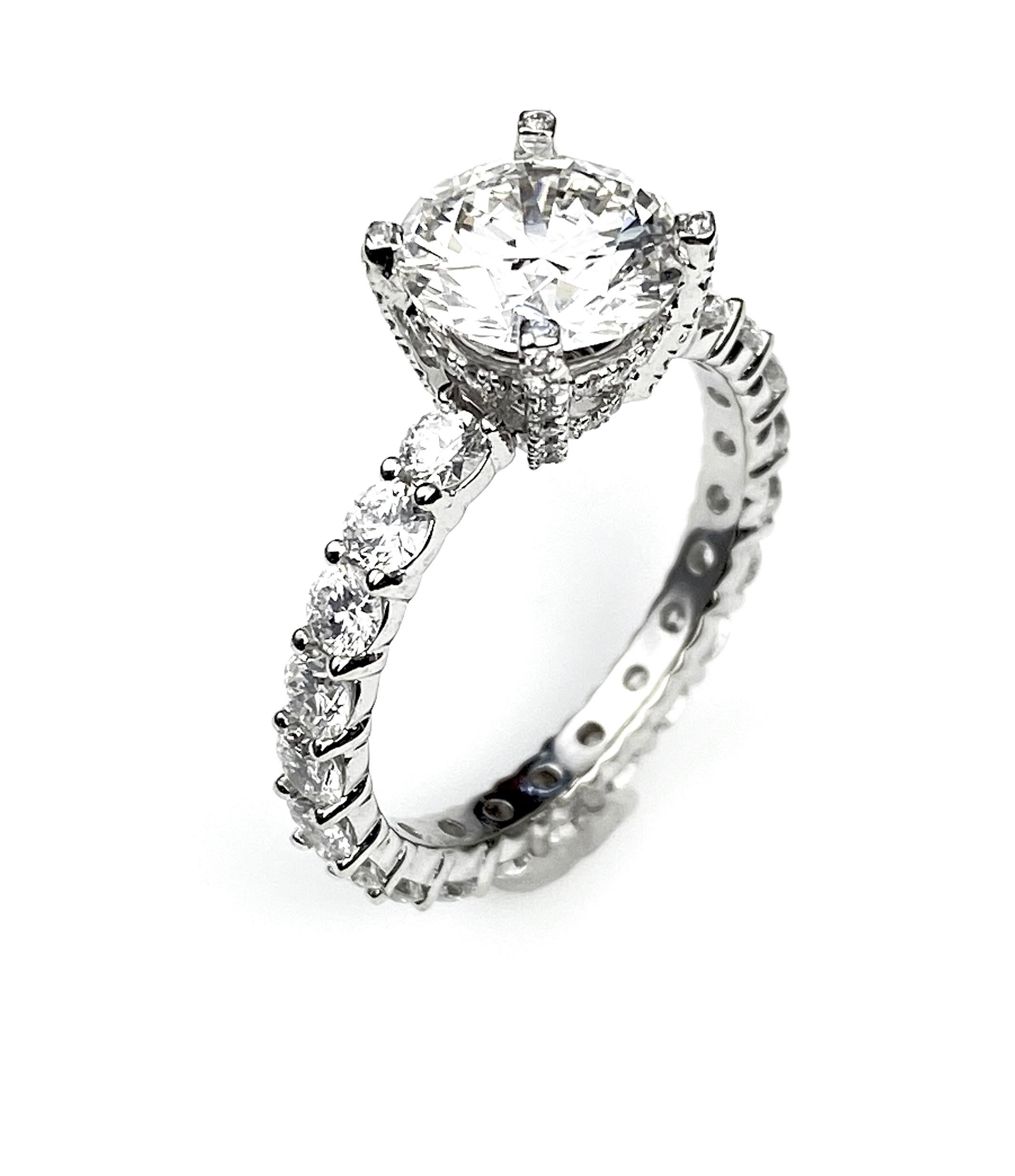Contemporary 2 Carat Round Cut Engagement Ring with Shared Claw Setting For Sale