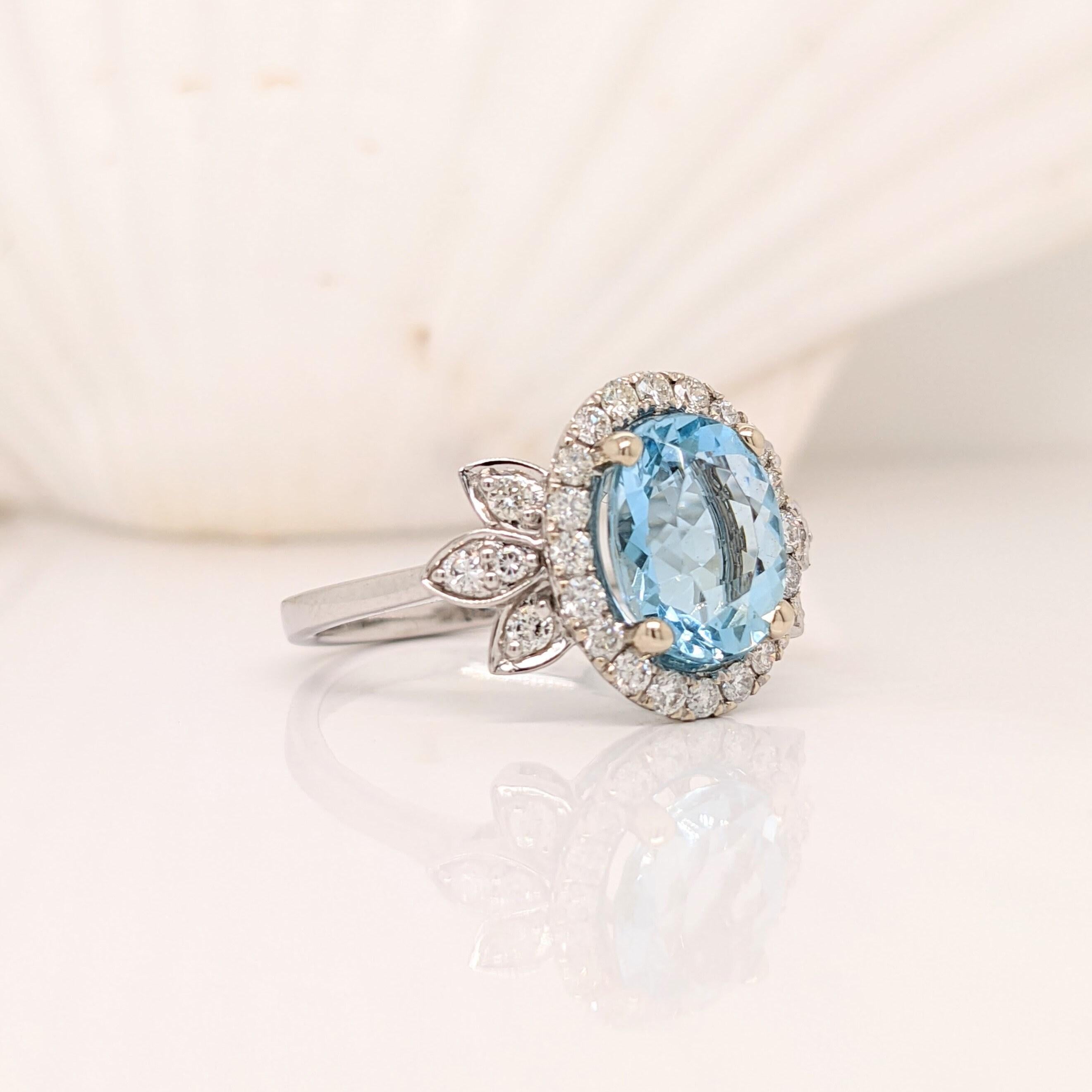A blue aquamarine in 14k white gold with all natural earth mined diamond accents. A statement ring design perfect for an eye catching engagement or anniversary. This ring also makes a beautiful birthstone ring for your loved