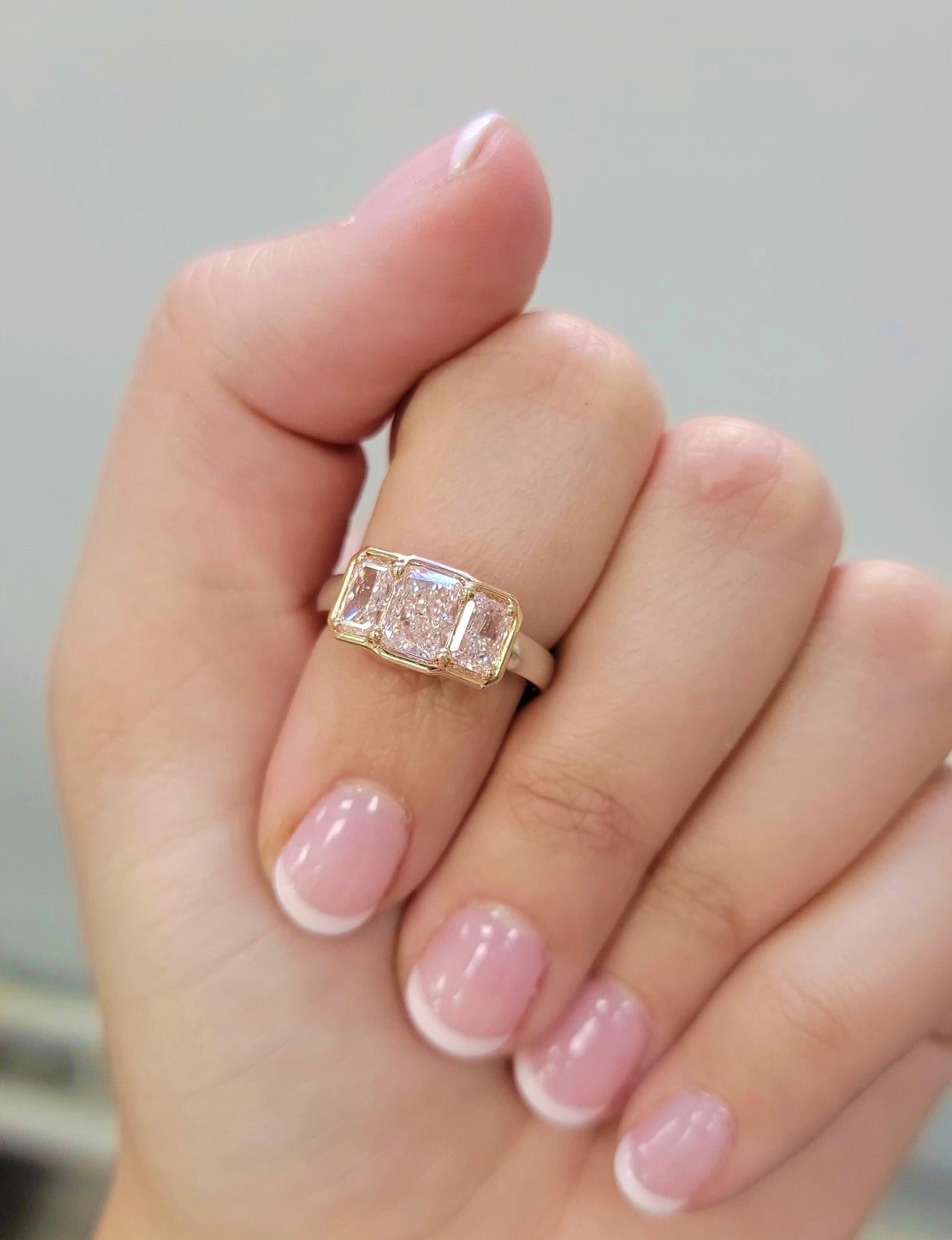 Unique and beautiful three stone ring with a 1.09ct GIA Light Pink VVS2 Long Radiant and a matched pair of 0.51ct GIA Light Pink Flawless and 0.56ct GIA Very Light Pink VVS1 elongated radiant cuts. 

1.09ct Light Pink VVS2 Diamond
0.51ct Light Pink
