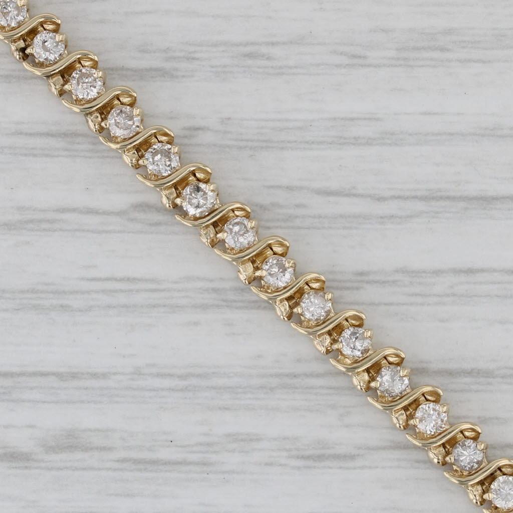 Gemstone Information:
- Natural Diamonds -
Total Carats - 2ctw
Cut - Round Brilliant
Color - K - L
Clarity - I1 - I2

Metal: 14k Yellow Gold
Weight: 11.8 Grams 
Stamps: 14k
Chain Style: Tennis
Closure: Snap & Latch
Inner Circumference: 6 3/4